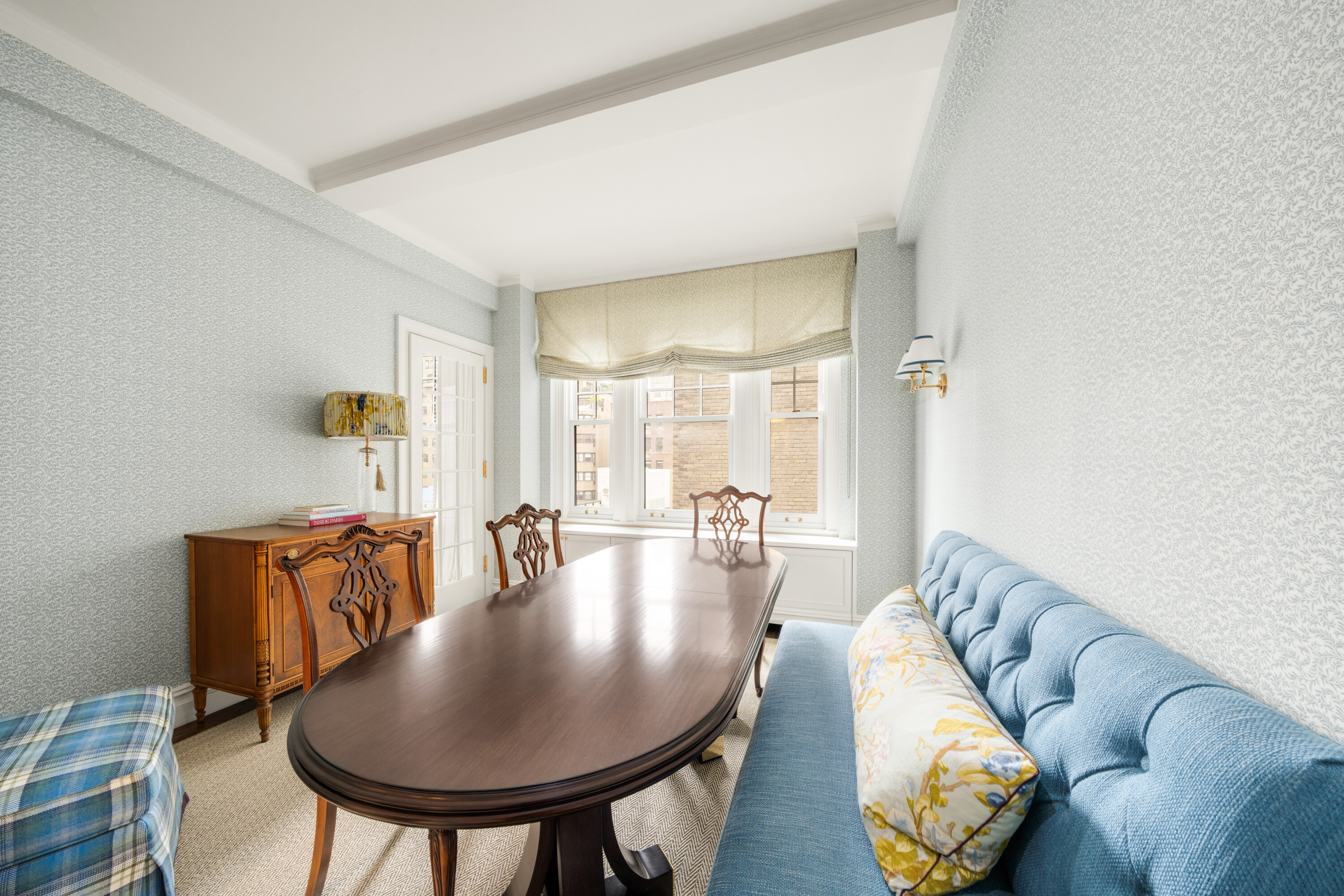 108 East 82nd Street, Unit 7C Manhattan, NY 10028 - Photo 3 of 9 a living room with furniture and a table