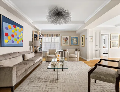 a living room with furniture and a rug