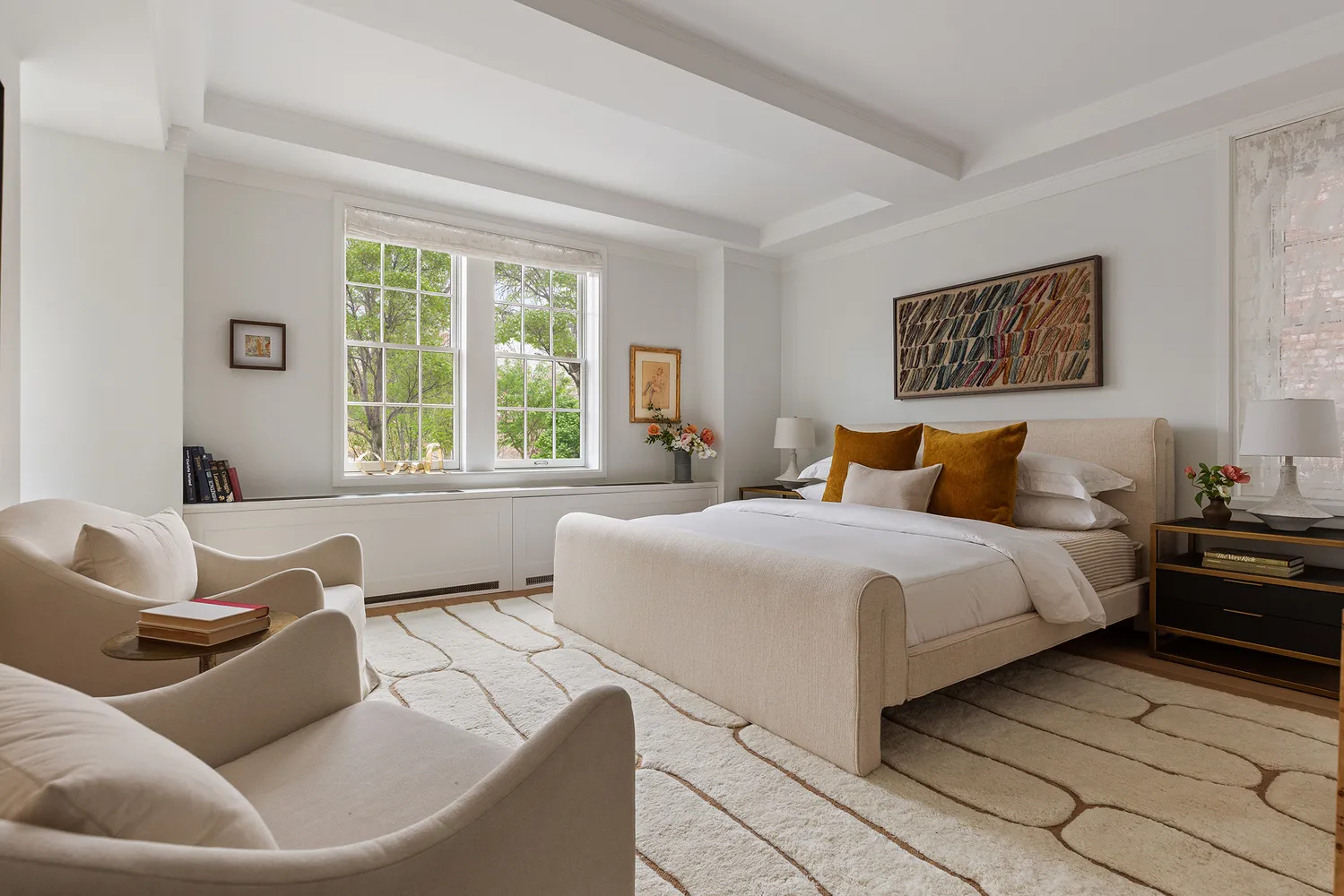 a bedroom with a large bed and a couch