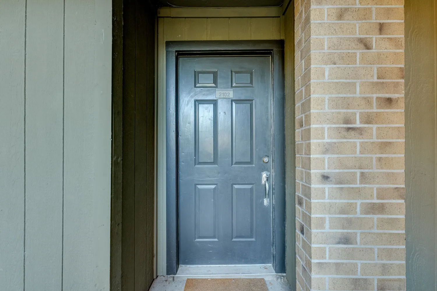 a view of kitchen with kitchen island wooden floor center island and stainless steel appliances