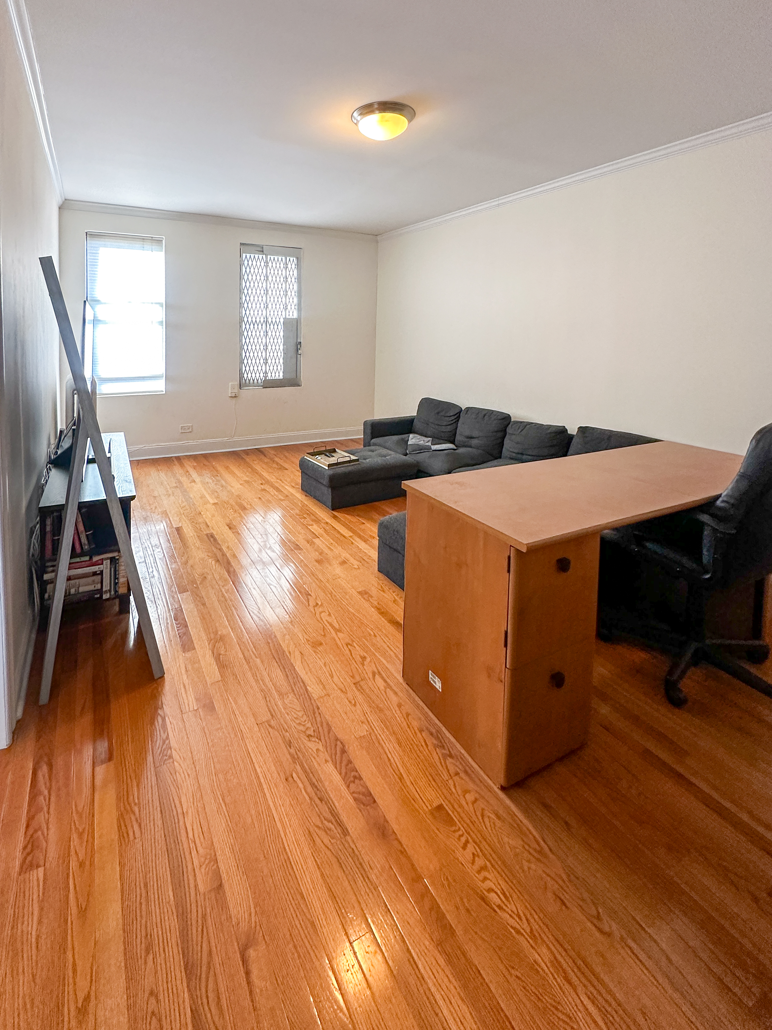 1506 Overing Street, Unit 1D Bronx, NY 10461 - Photo 9 of 10 a room with wooden floor and gym equipment