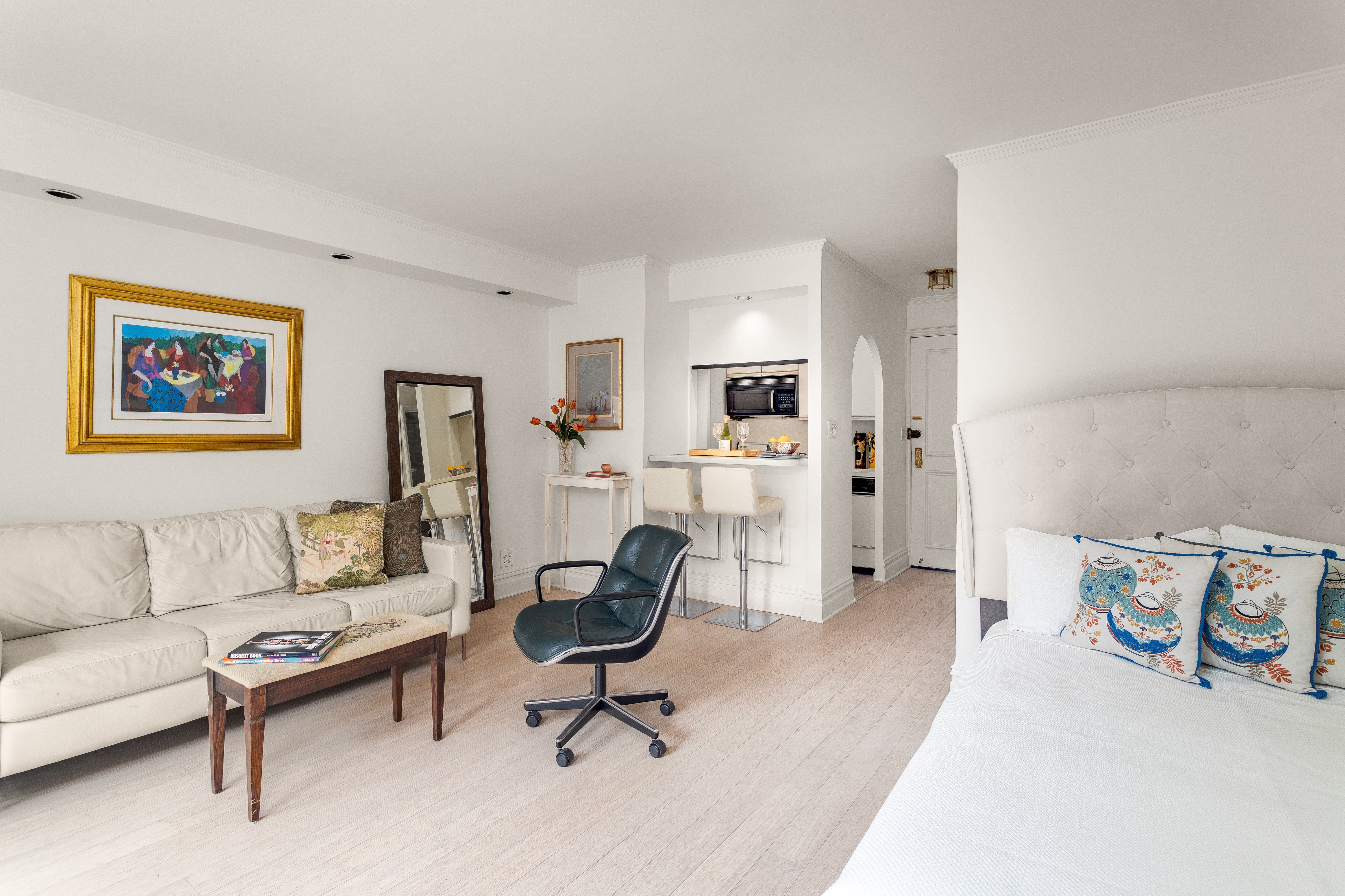 251 East 51st Street, Unit 6K Manhattan, NY 10022 - Photo 2 of 16 a living room with furniture and a fireplace