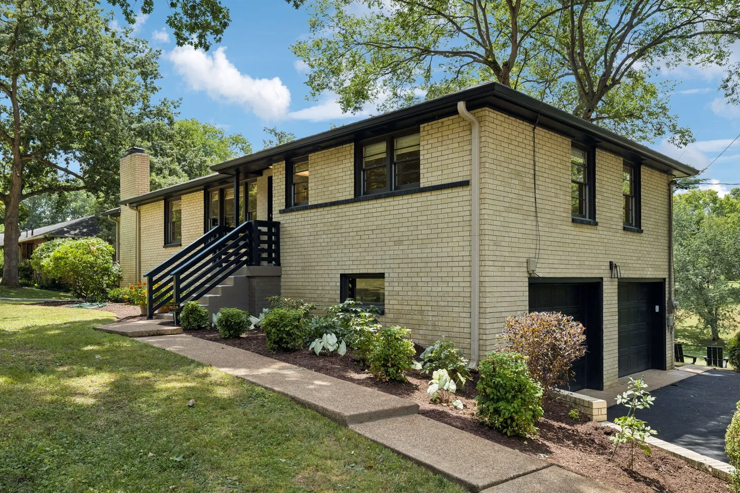 a front view of a house with garden