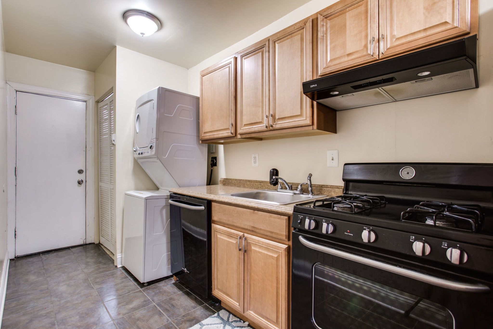 928 19th Street Northeast Washington, DC 20002 - Photo 8 of 13 a kitchen with stainless steel appliances granite countertop a stove and a refrigerator