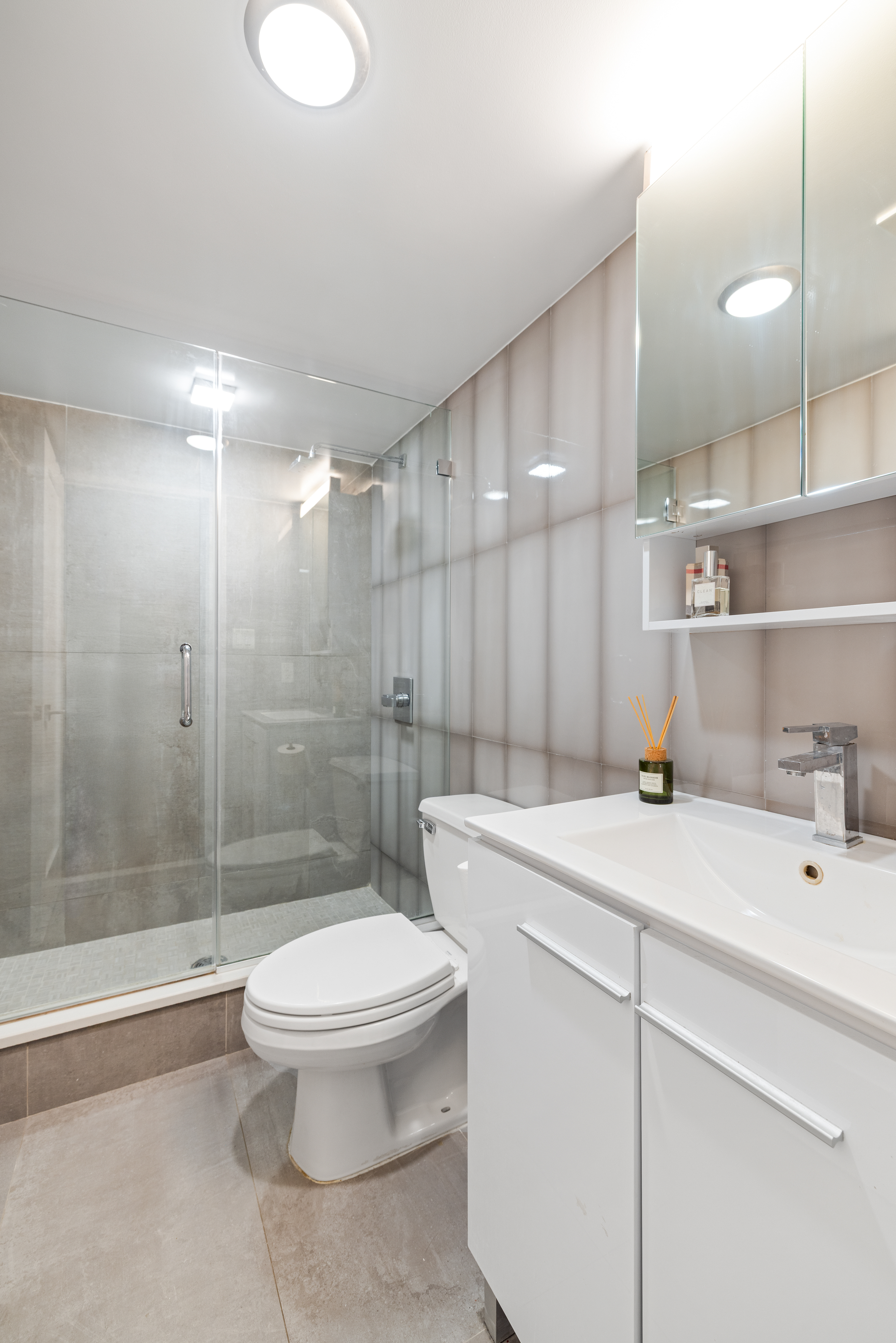 1115-1139 Prospect Avenue, Unit 1B Brooklyn, NY 11218 - Photo 4 of 9 a bathroom with a sink a toilet and shower