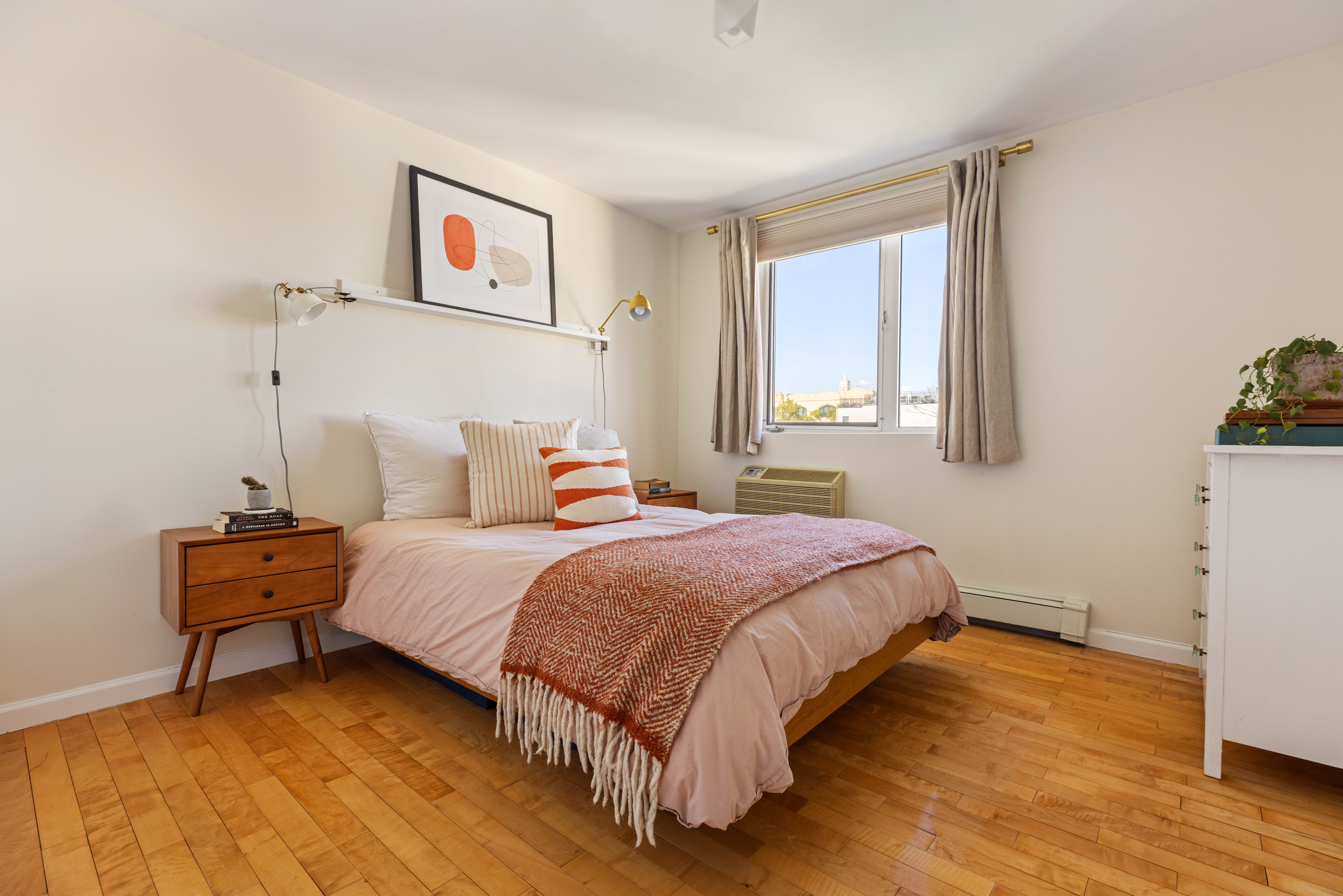93-95 Wyckoff Avenue, Unit 4B Brooklyn, NY 11237 - Photo 5 of 10 a bedroom with a bed and wooden floor