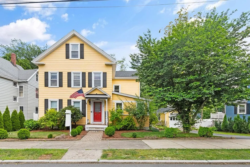 a front view of a house with garden