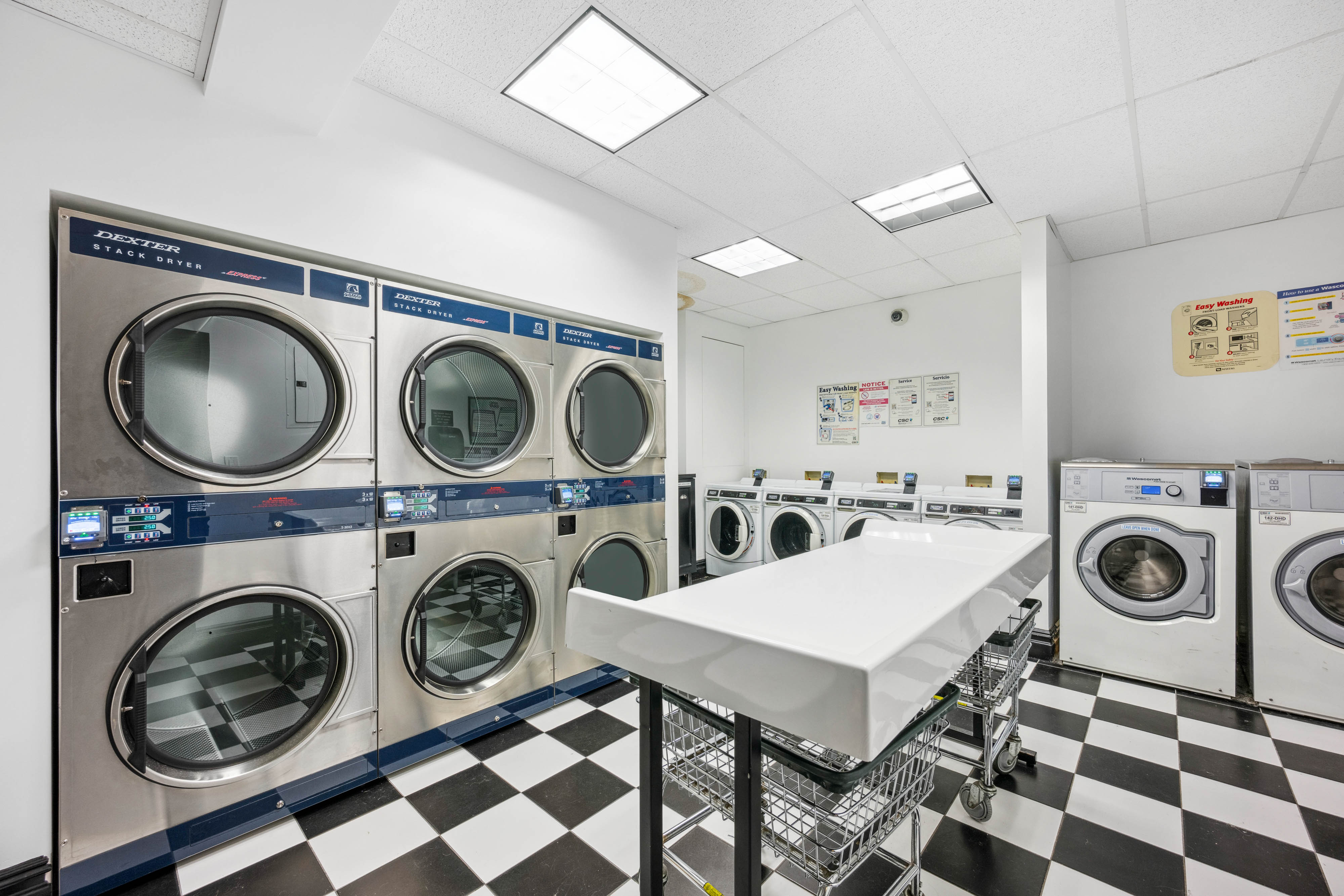 25 5th Avenue, Unit 6C Manhattan, NY 10003 - Photo 13 of 16 a view of a washer and dryer in a utility room