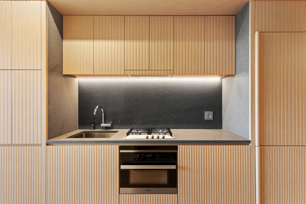 565 Broome Street, Unit N5B Manhattan, NY 10013 - Photo 3 of 11 a kitchen with a sink and a stove