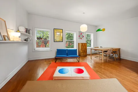 a living room with furniture and a table