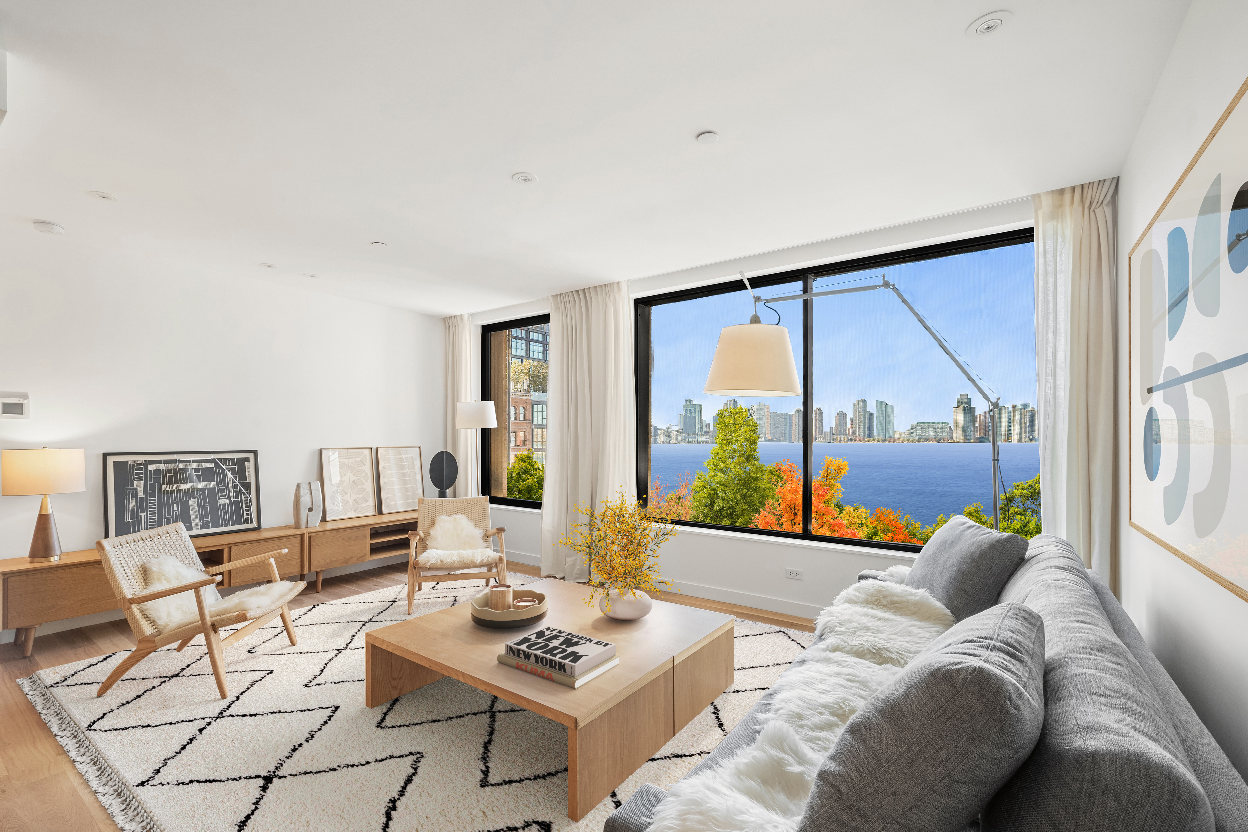 479 Washington Street, Unit 4 Manhattan, NY 10013 - Photo 1 of 8 a living room with furniture and a large window