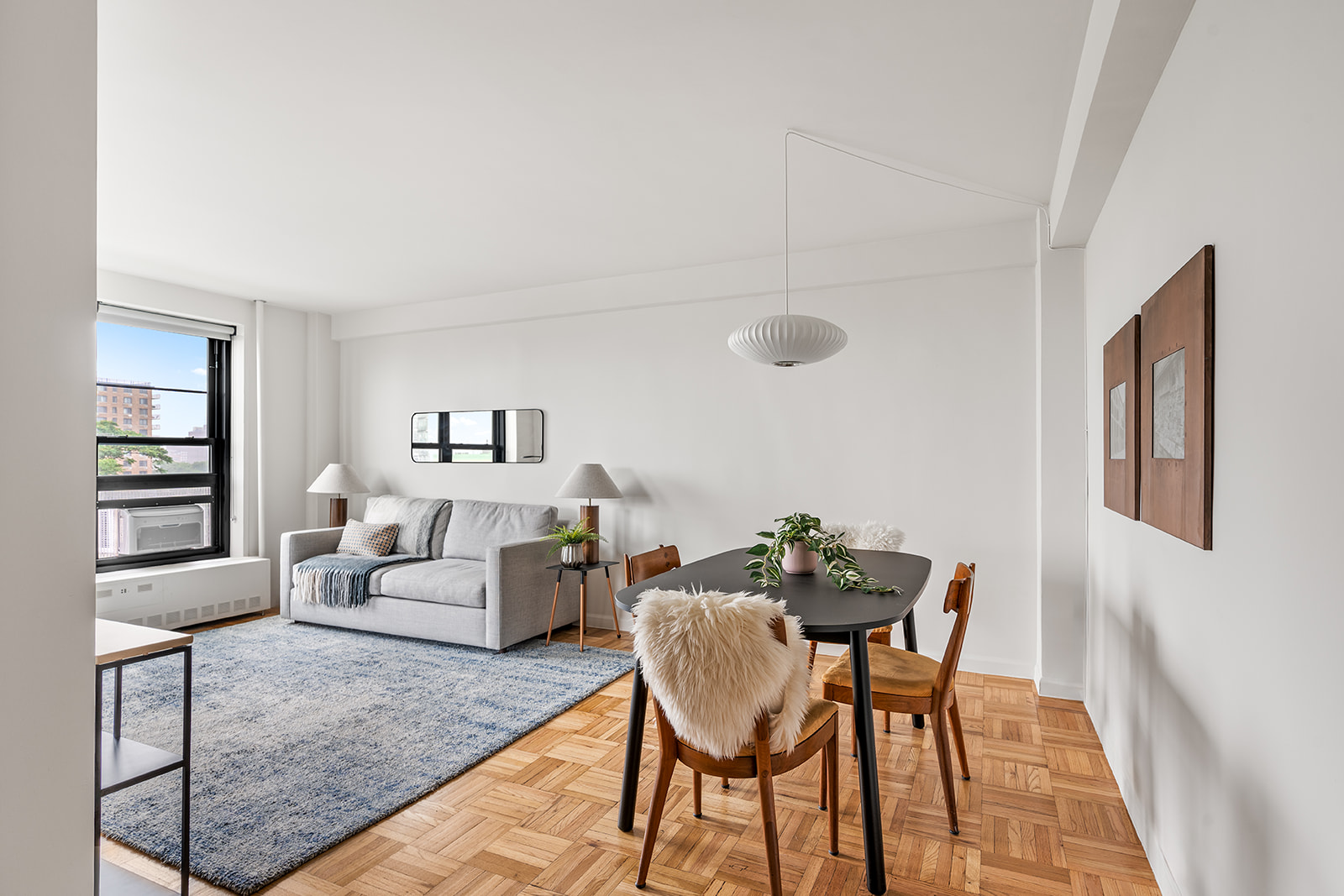 193 Clinton Avenue, Unit 9D Brooklyn, NY 11205 - Photo 2 of 11 a view of a livingroom with furniture and wooden floor
