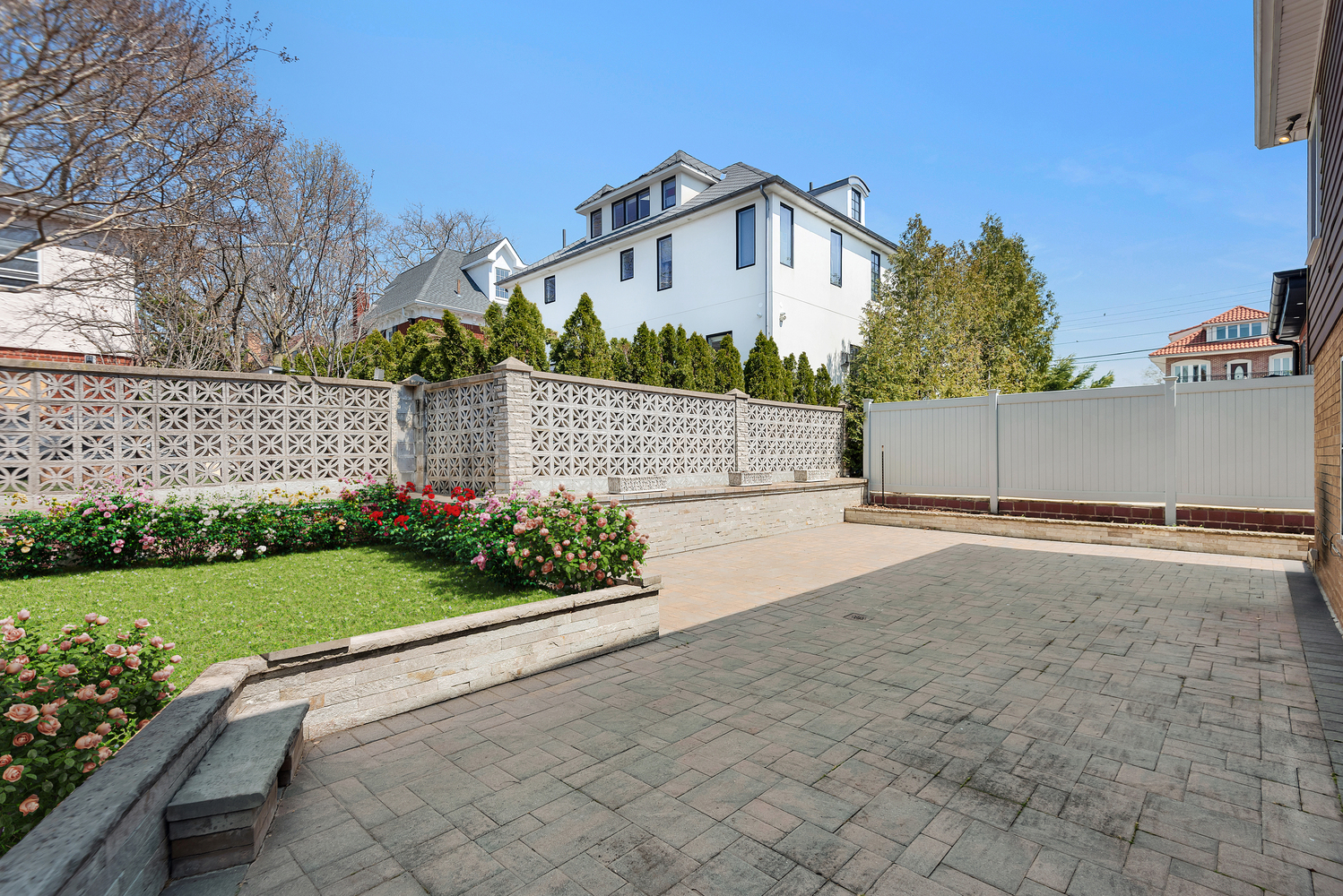 95 83rd Street Brooklyn, NY 11209 - Photo 17 of 18 a view of a house with a yard and large tree