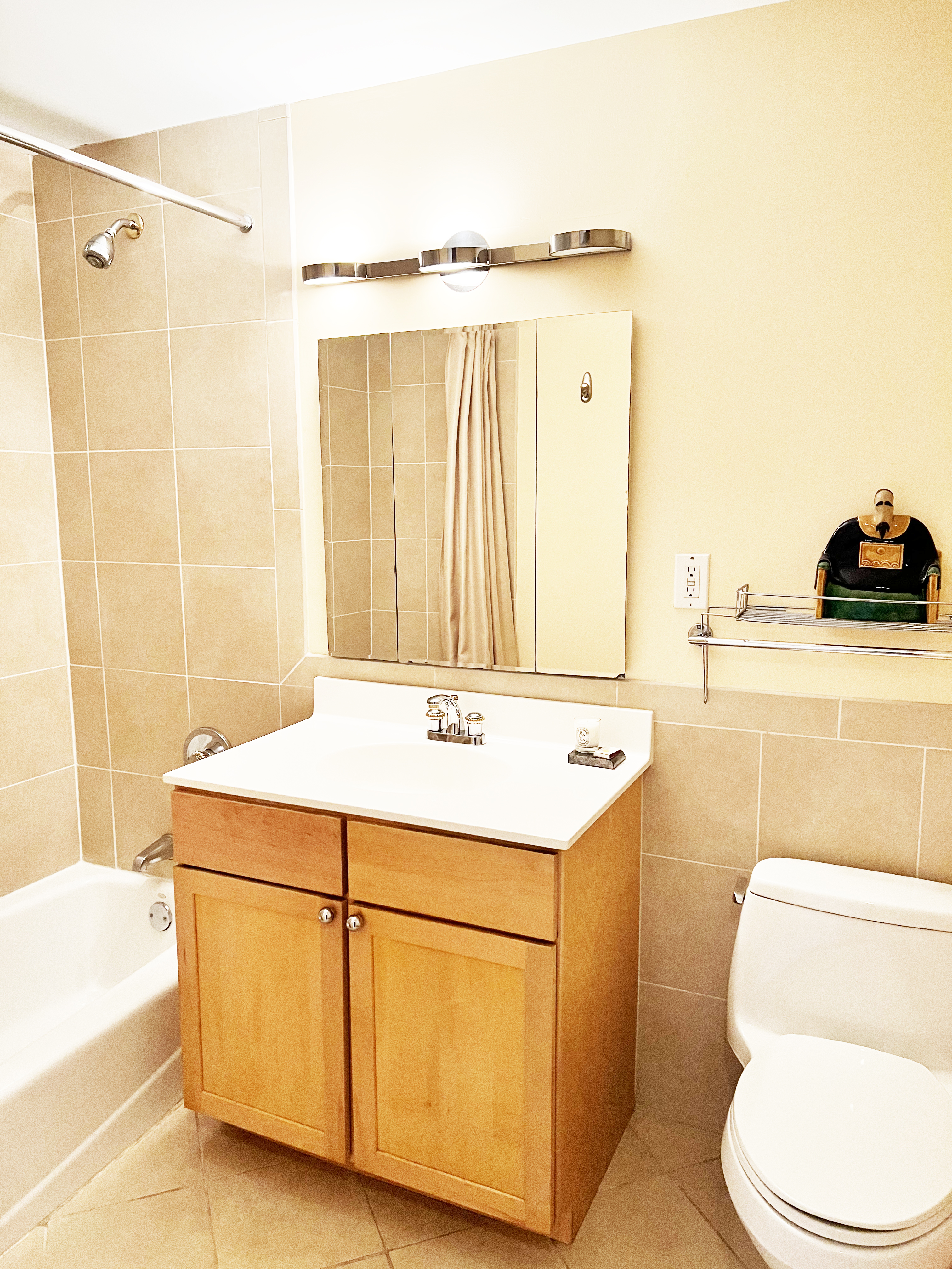 1787 Madison Avenue, Unit 505 Manhattan, NY 10035 - Photo 6 of 11 a bathroom with a sink a toilet and shower
