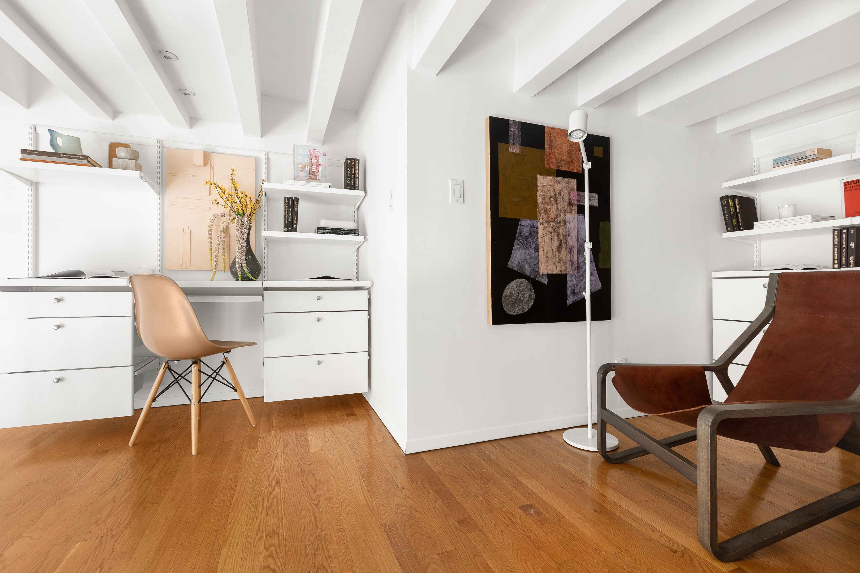 250 Mercer Street, Unit C415 Manhattan, NY 10012 - Photo 9 of 11 a workspace with furniture and wooden floor