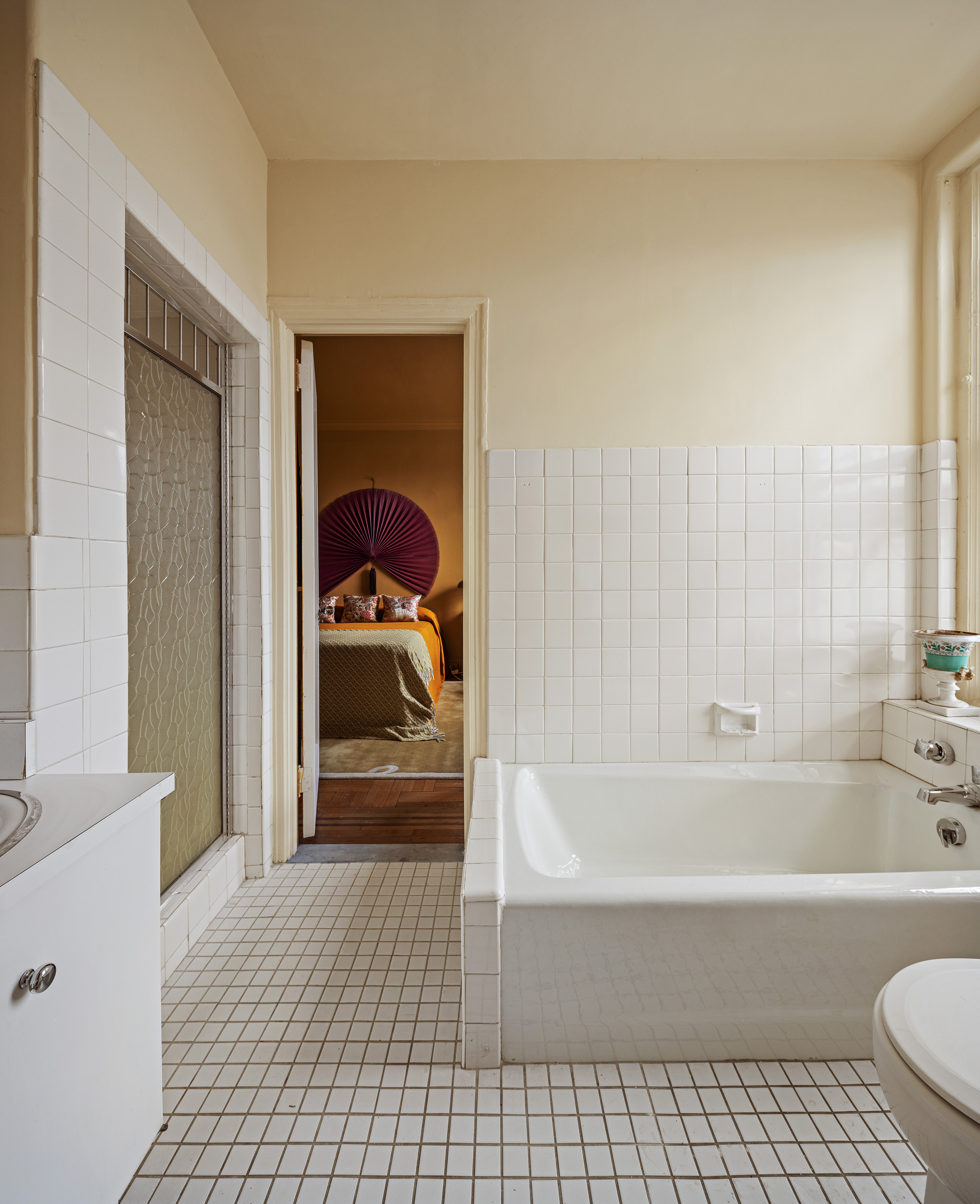 1136 5th Avenue, Unit 6A Manhattan, NY 10128 - Photo 37 of 44 a bathroom with a bathtub and a shower