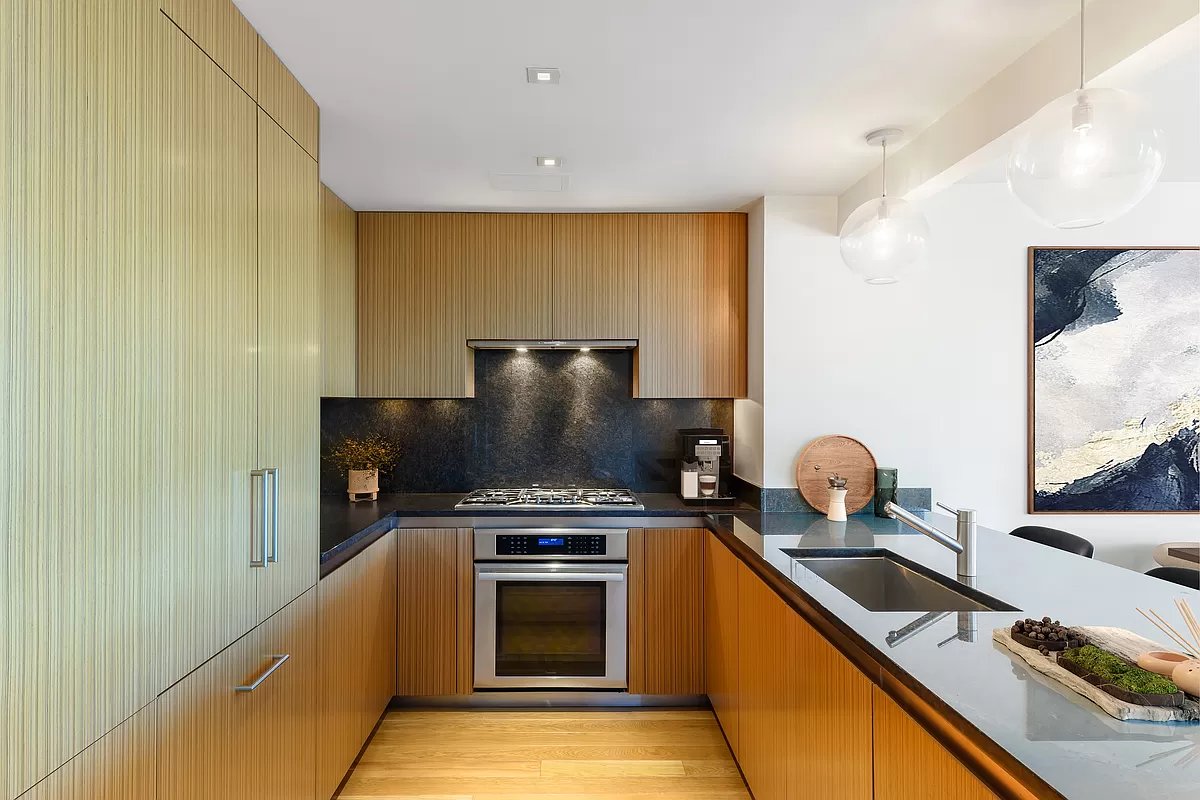 1280 5th Avenue, Unit 10A Manhattan, NY 10029 - Photo 3 of 15 a kitchen with a stove and a refrigerator