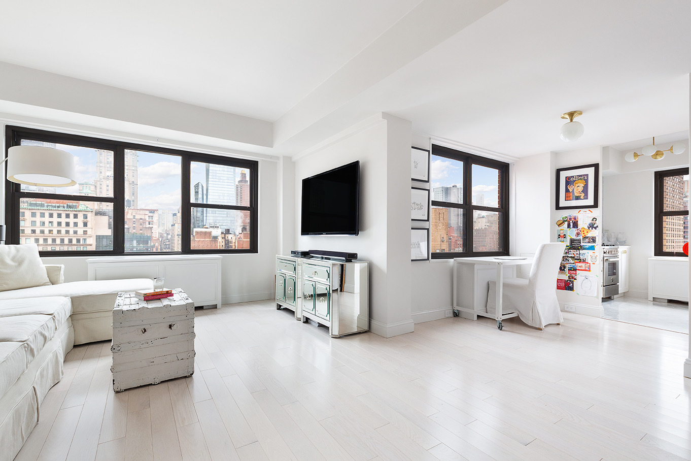 200 East 27th Street, Unit 19C Manhattan, NY 10016 - Photo 2 of 8 a living room with furniture and a flat screen tv