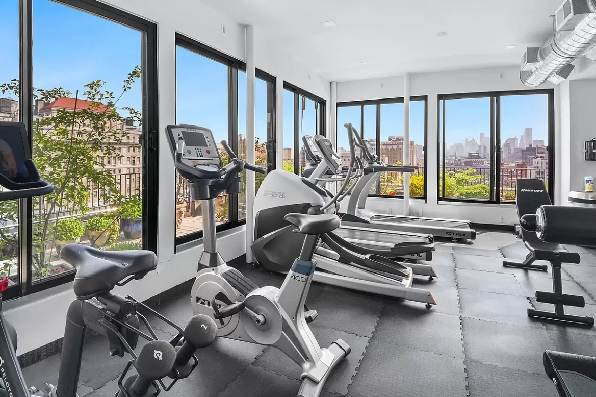 305 2nd Avenue, Unit 516 Manhattan, NY 10003 - Photo 13 of 21 a room with gym equipment and a large window