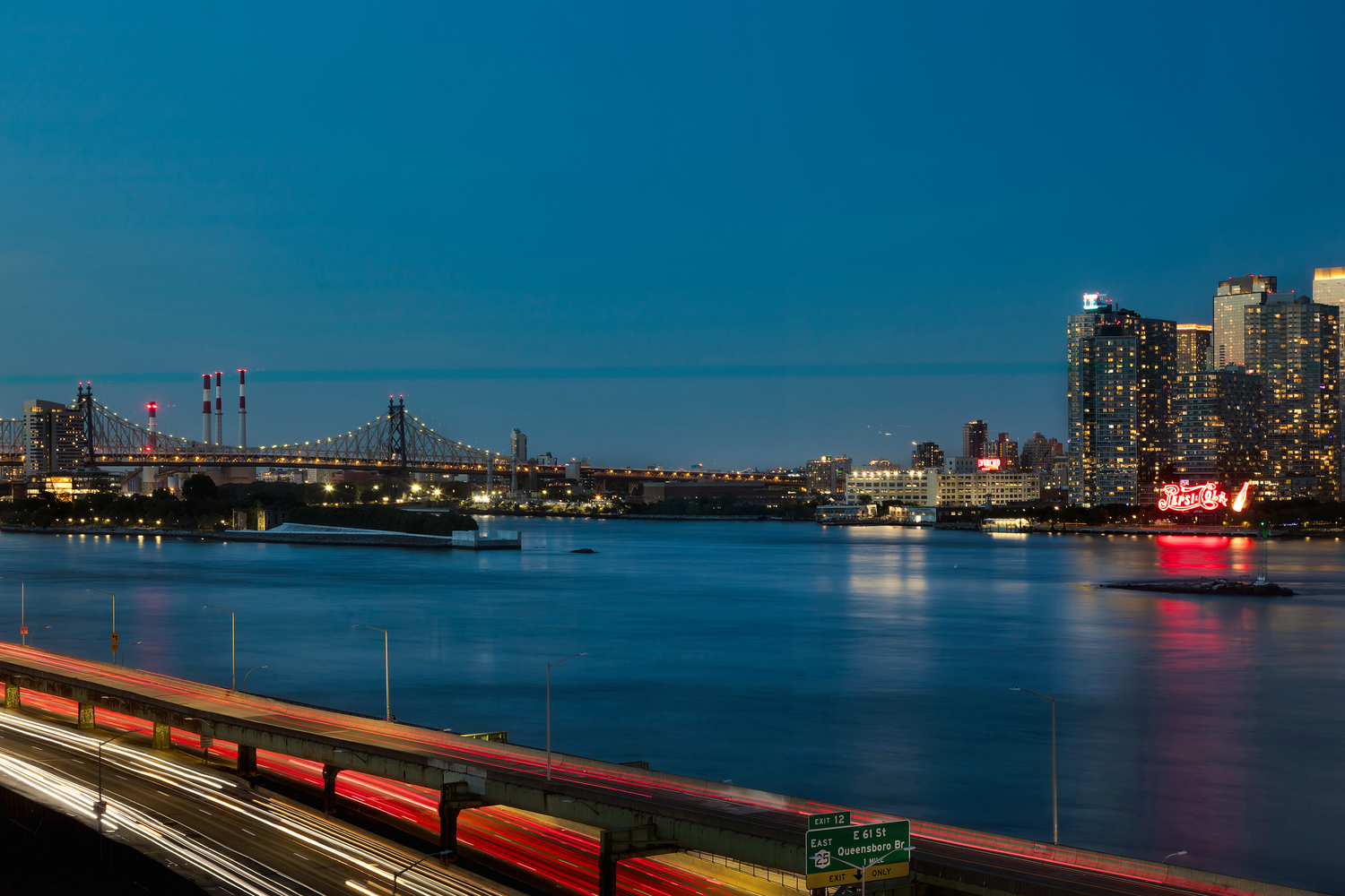 415 East 37th Street, Unit 9JK Manhattan, NY 10016 - Photo 6 of 28 a view of water with boats and trees in the background