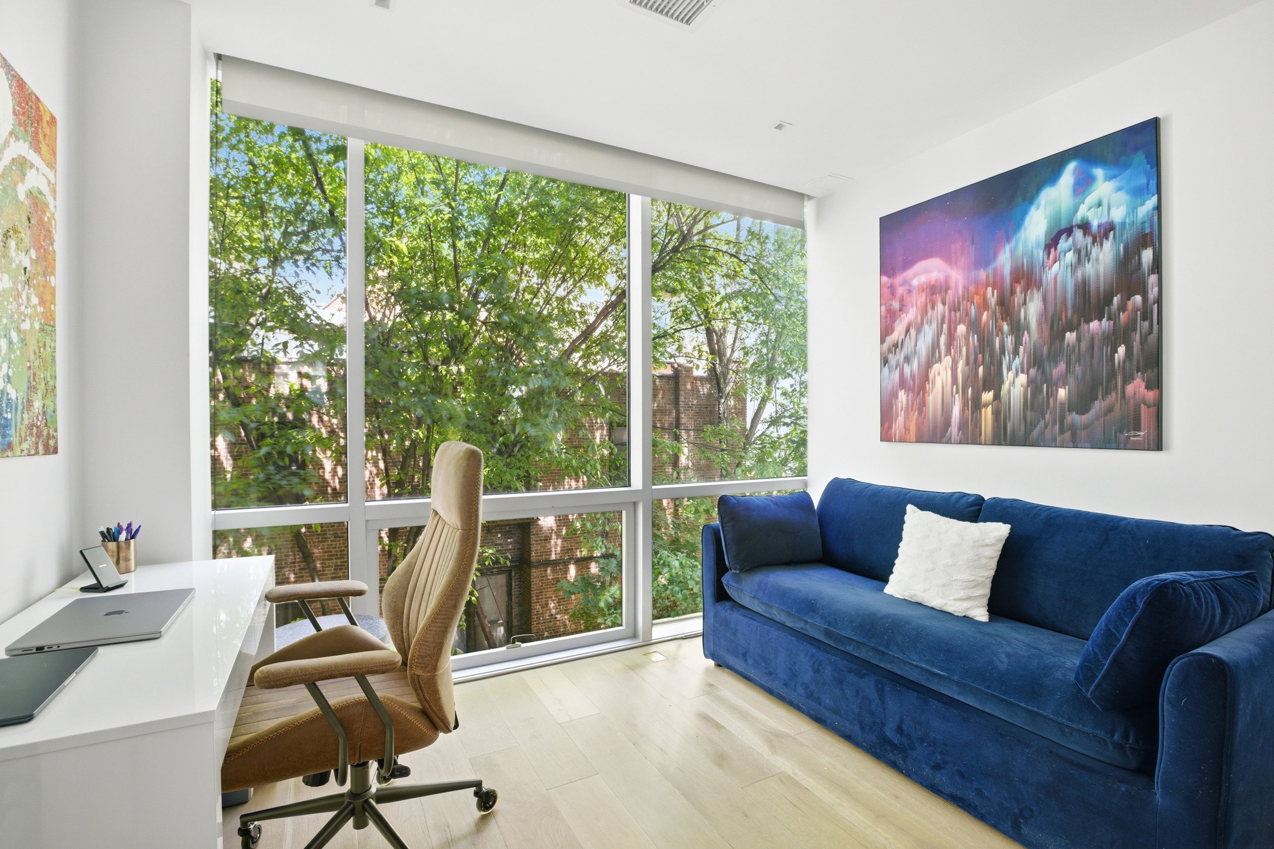 313 West 121st Street, Unit 2 Manhattan, NY 10027 - Photo 6 of 12 a view of a livingroom with workspace and a couch