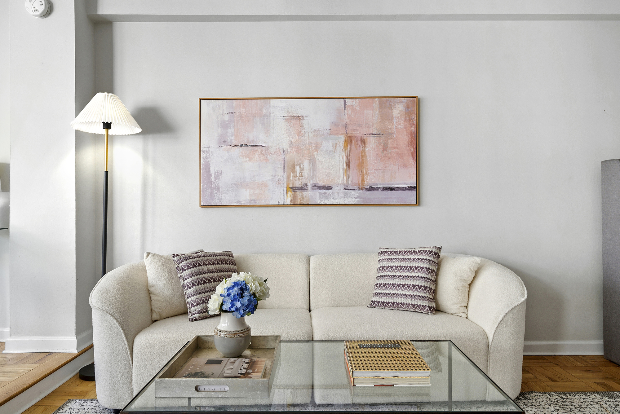 7 Lexington Avenue, Unit 12F Manhattan, NY 10010 - Photo 5 of 12 a living room with furniture and a painting