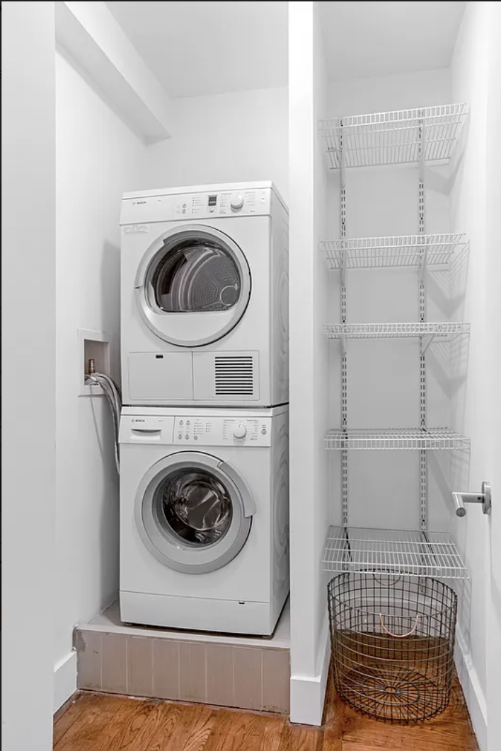 245 West 25th Street, Unit 1P Manhattan, NY 10001 - Photo 3 of 13 a utility room with dryer and washer