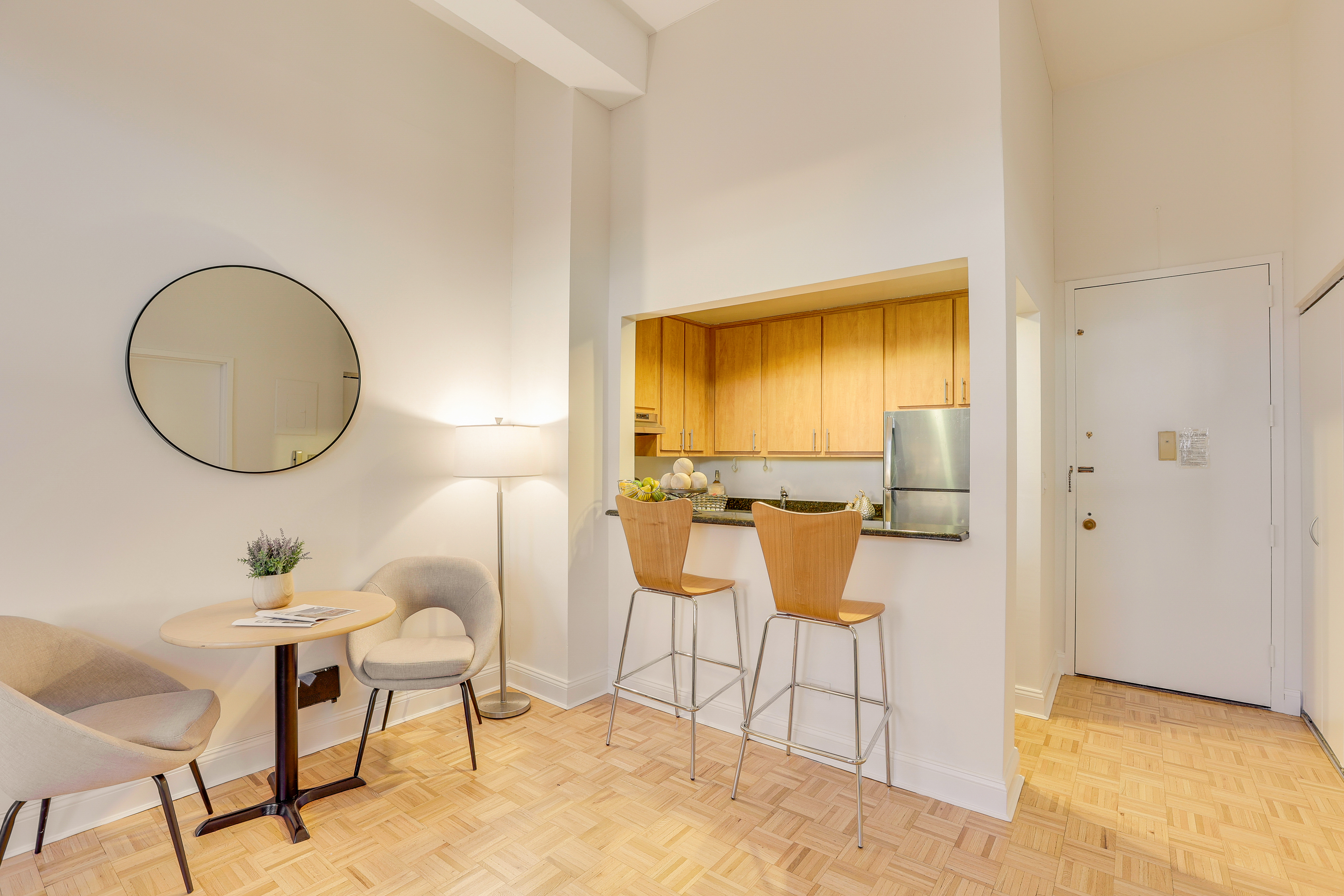 1255 5th Avenue, Unit 5B Manhattan, NY 10029 - Photo 7 of 12 a dining room with furniture and a mirror