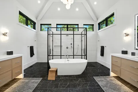 a kitchen with stainless steel appliances granite countertop a sink and stove