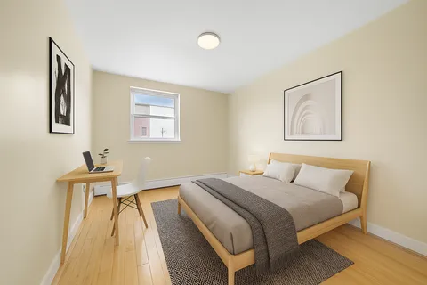 a bedroom with a bed and a table