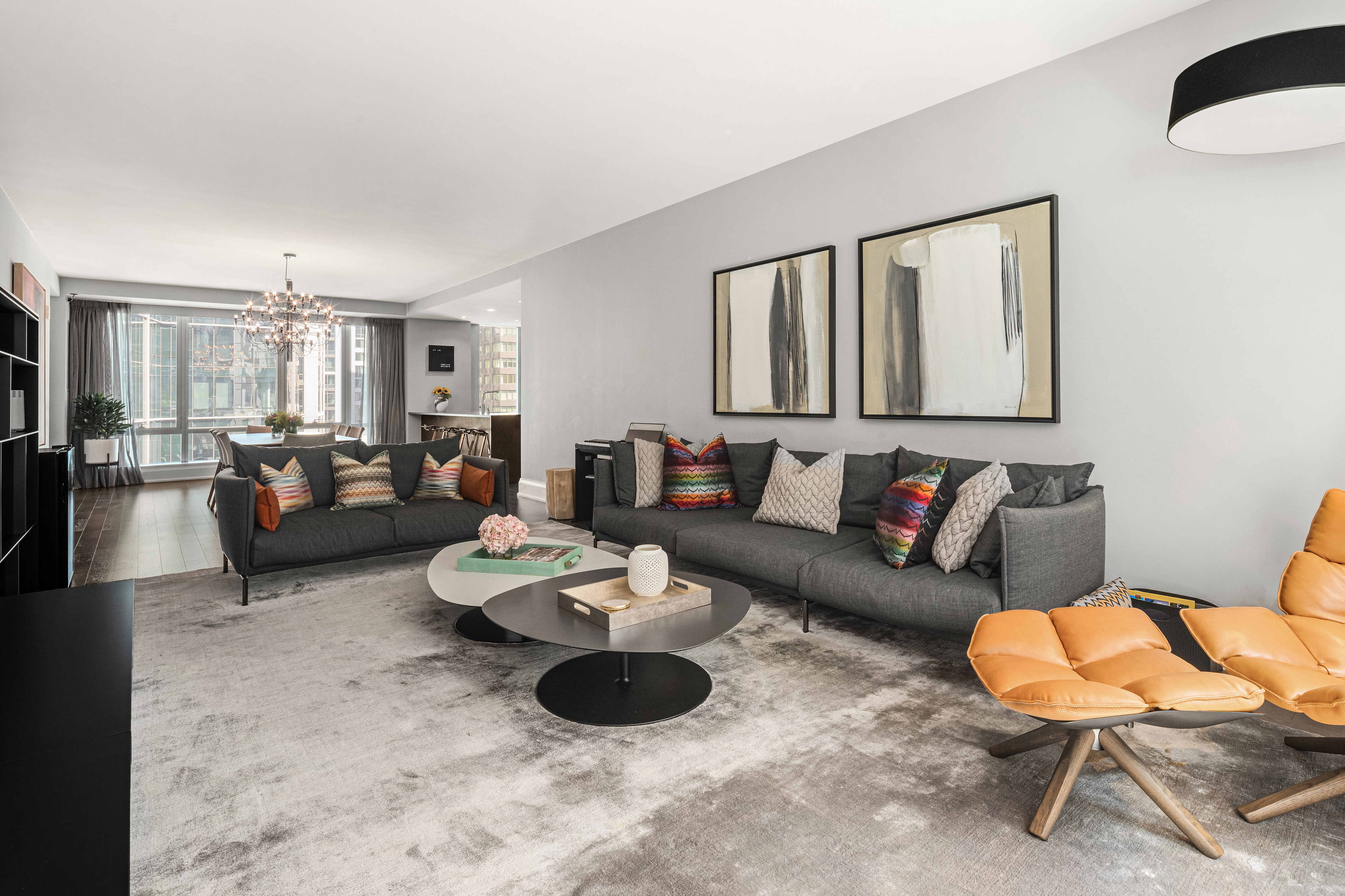 50 Riverside Boulevard, Unit 10P Manhattan, NY 10069 - Photo 5 of 21 a living room with furniture and a wooden floor