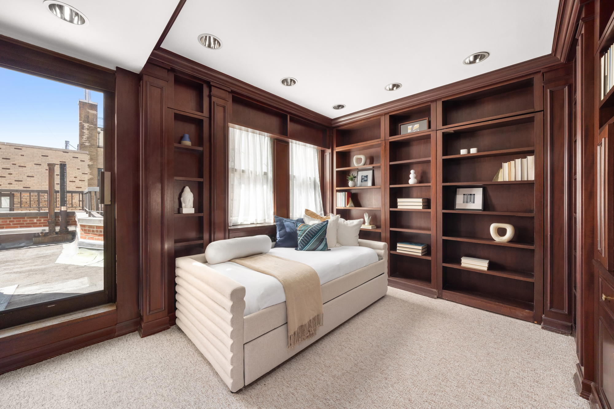 1049 Park Avenue, Unit PH Manhattan, NY 10028 - Photo 14 of 22 a spacious bedroom with a bed and large window