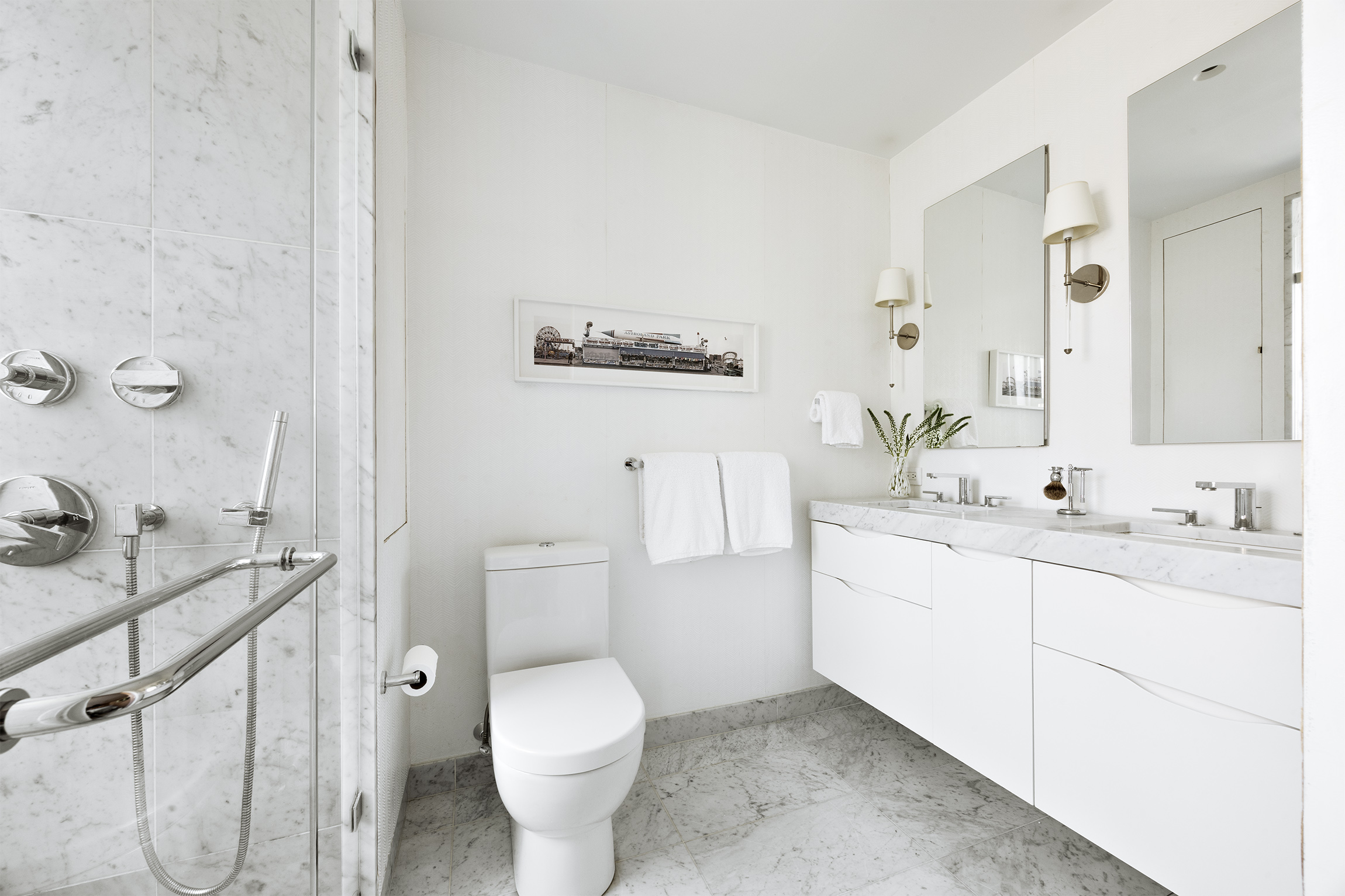 1035 Park Avenue, Unit 11B Manhattan, NY 10028 - Photo 8 of 13 a bathroom with a sink toilet and vanity