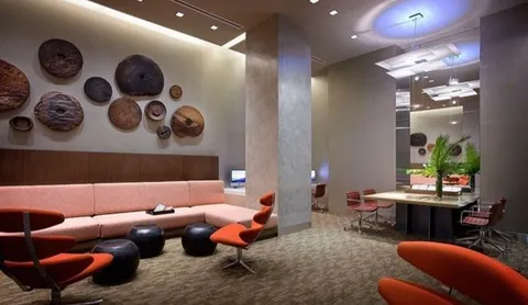 a living room with furniture and baby