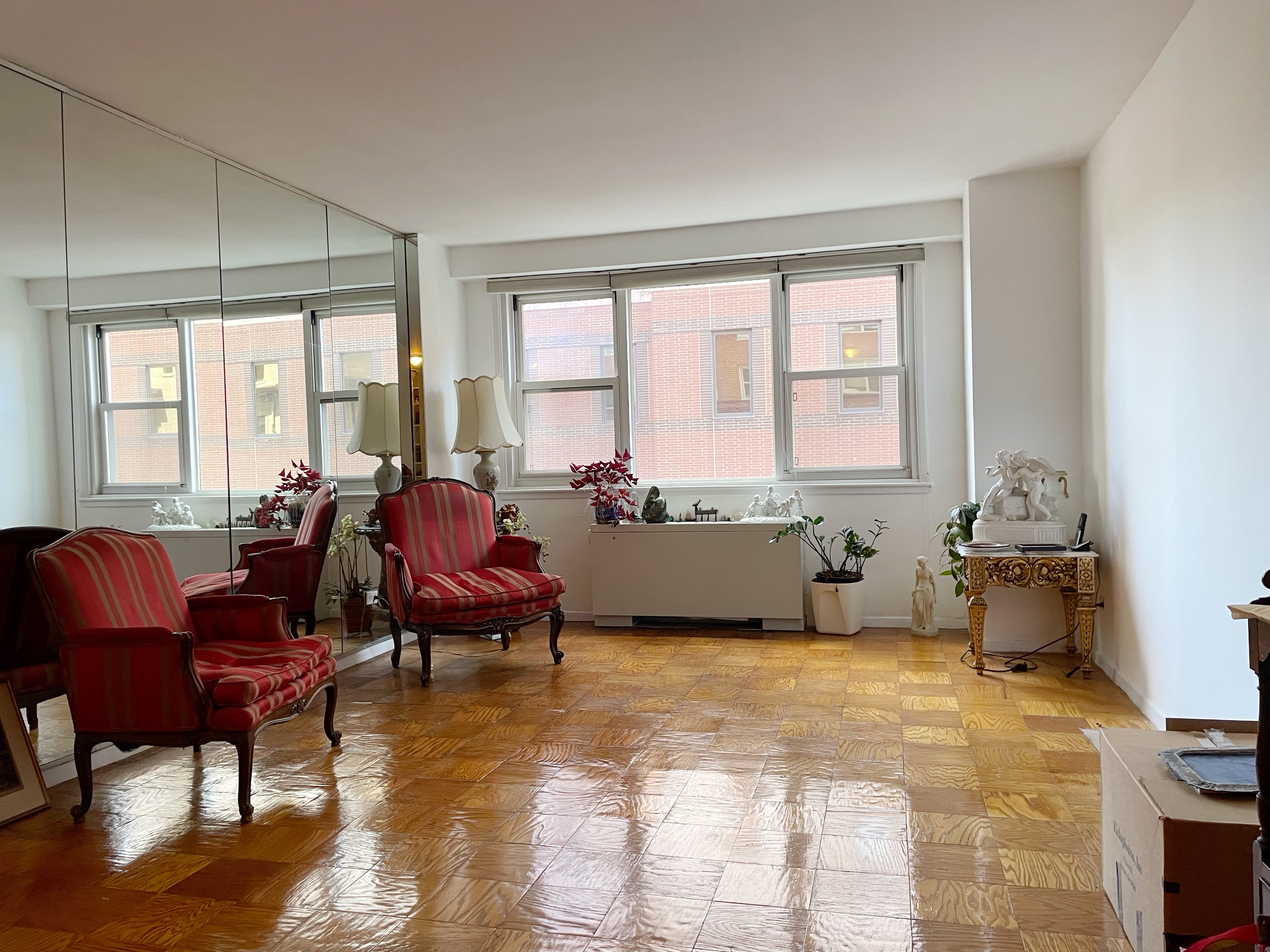 40 Clinton Street, Unit 8L Brooklyn, NY 11201 - Photo 1 of 7 a living room with furniture and a window