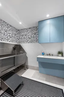 a view of kitchen with a sink and cabinets