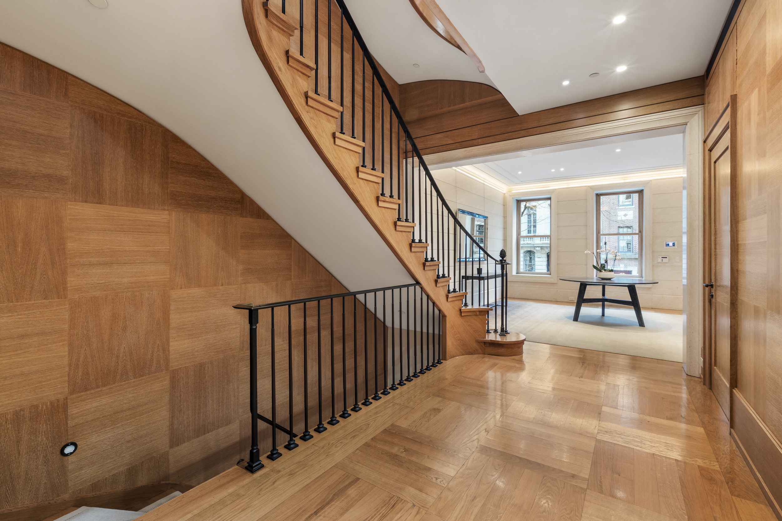 45 East 74th Street Manhattan, NY 10021 - Photo 5 of 33 a view of a hallway with wooden floor and stairs