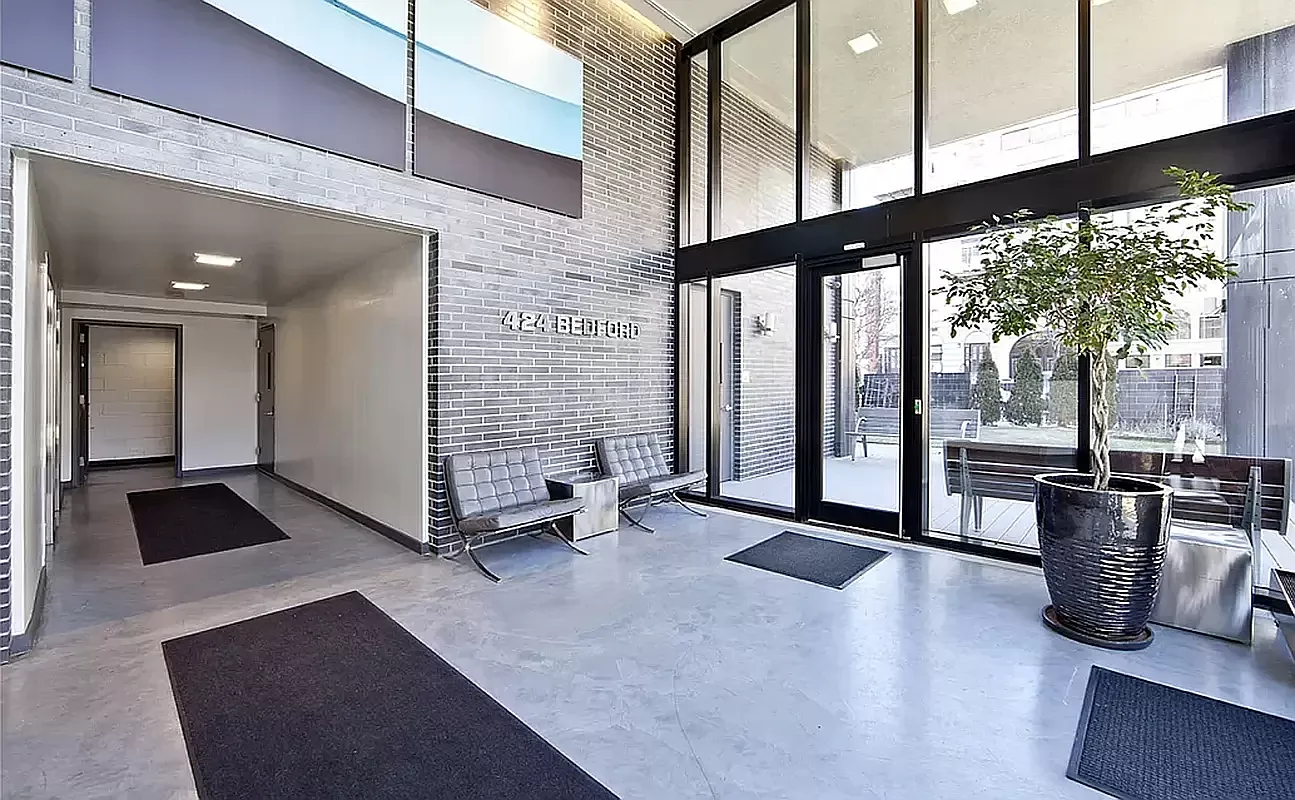 424 Bedford Avenue, Unit 5C Brooklyn, NY 11249 - Photo 7 of 11 a view of lobby with furniture and floor to ceiling window