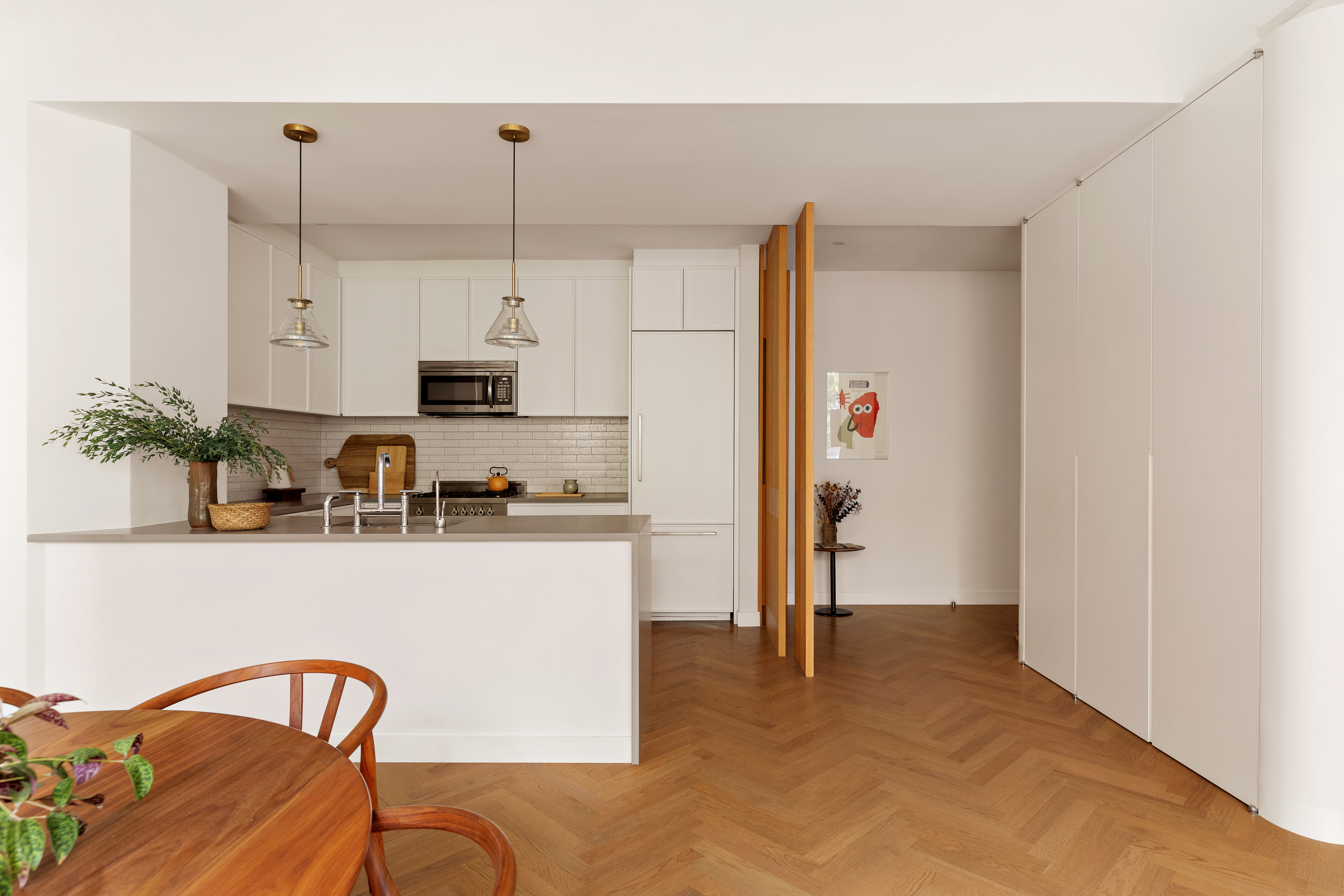 184 Kent Avenue, Unit A512 Brooklyn, NY 11249 - Photo 5 of 16 a kitchen with stainless steel appliances granite countertop a refrigerator and a stove top oven
