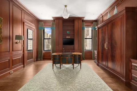 a dining room with furniture and window