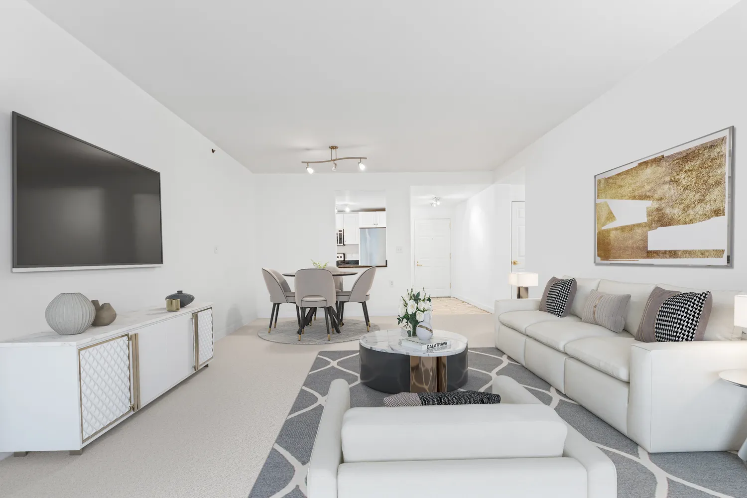 a living room with furniture and a flat screen tv