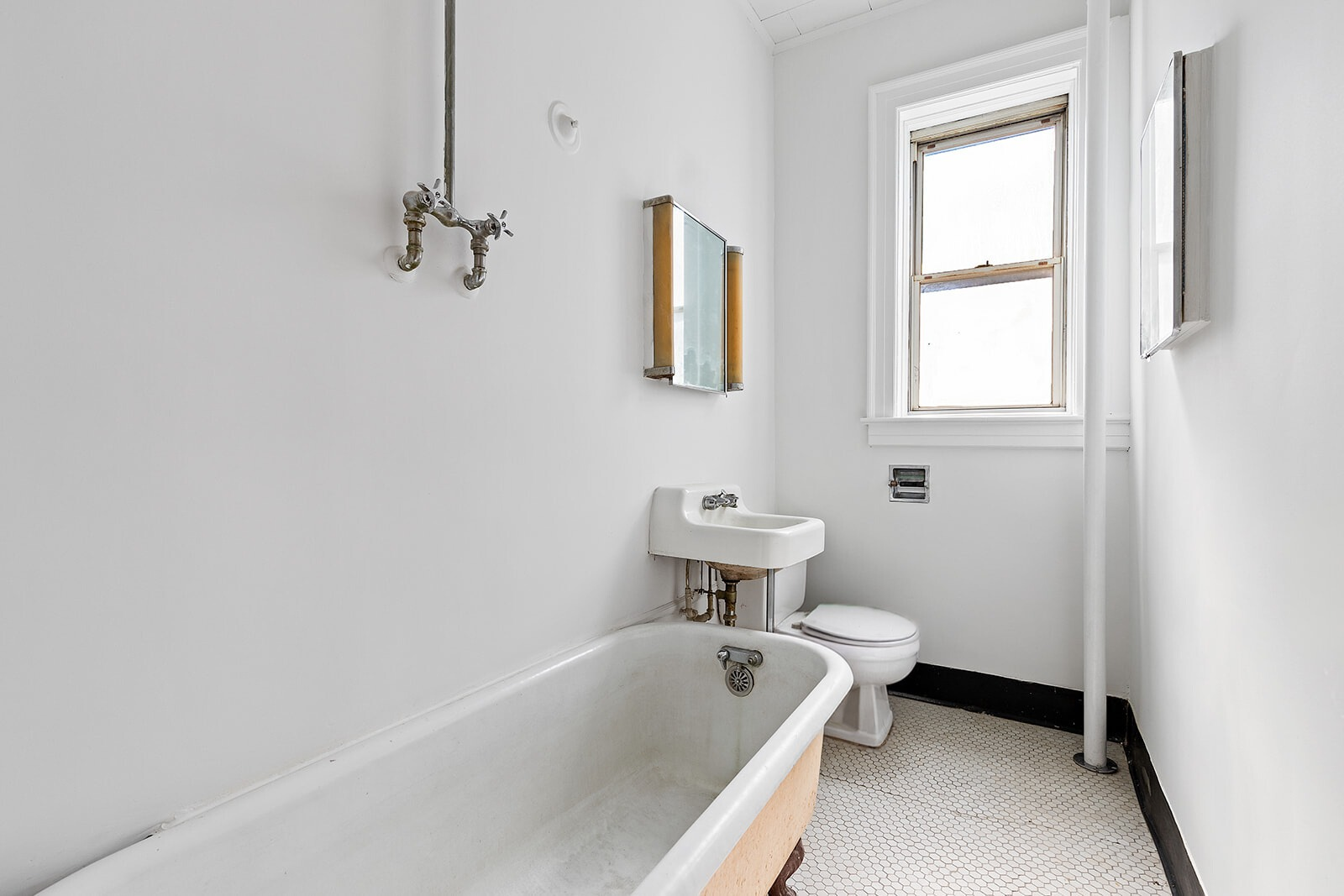 4401 4th Avenue, Unit D4 Brooklyn, NY 11220 - Photo 4 of 7 a bathroom with a sink a toilet and bathtub