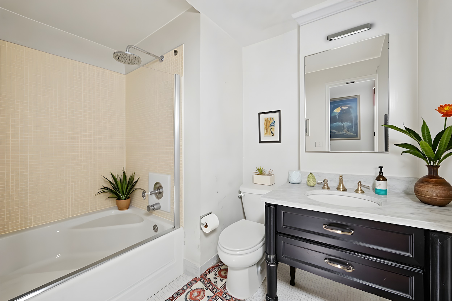 80 Central Park West, Unit 4C Manhattan, NY 10023 - Photo 6 of 11 a bathroom with a granite countertop sink a toilet a mirror and shower