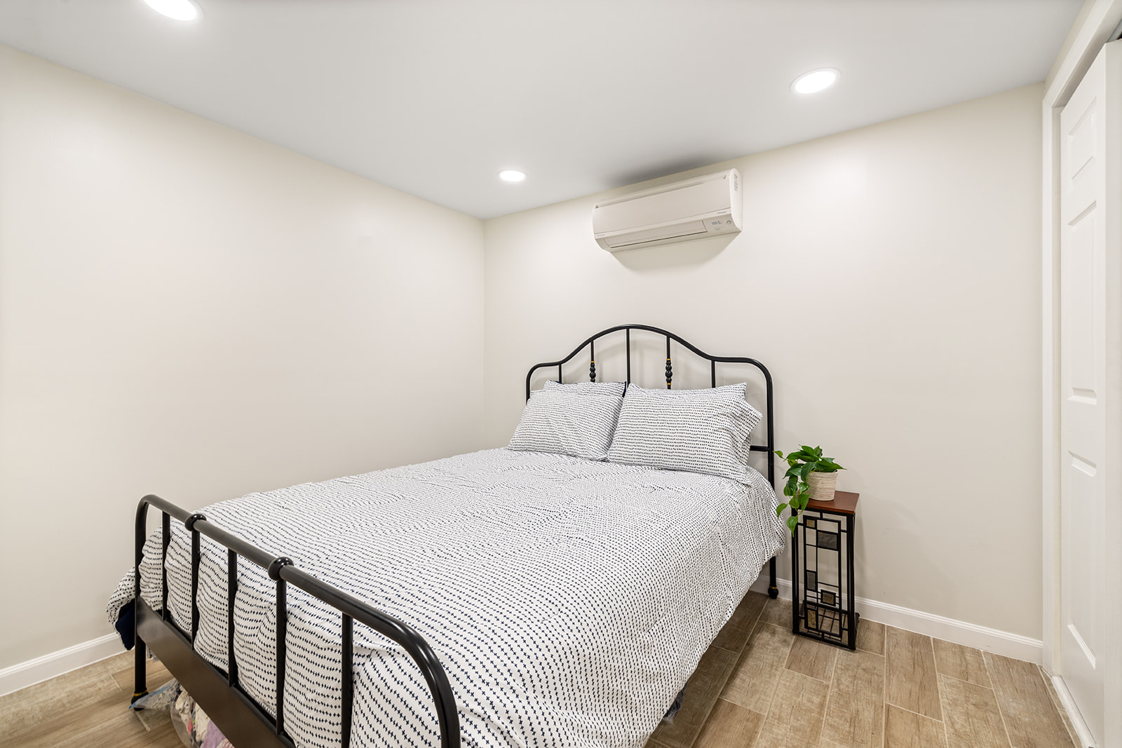 466 81st Street Brooklyn, NY 11209 - Photo 11 of 15 a bedroom with a bed and wooden floor