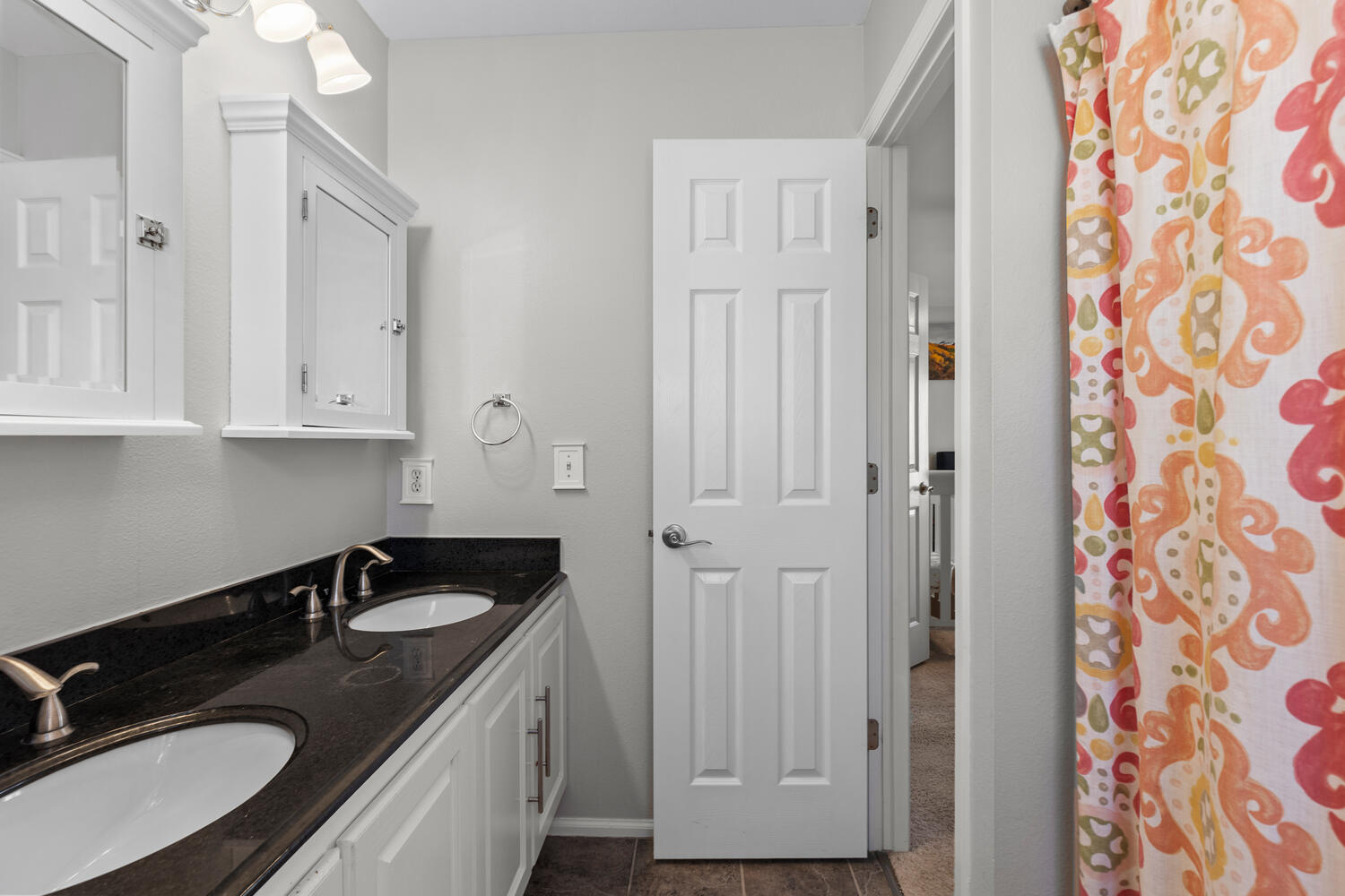 847 Timbervale Trail Highlands Ranch, CO 80129 - Photo 21 of 36 a bathroom with a sink and a mirror