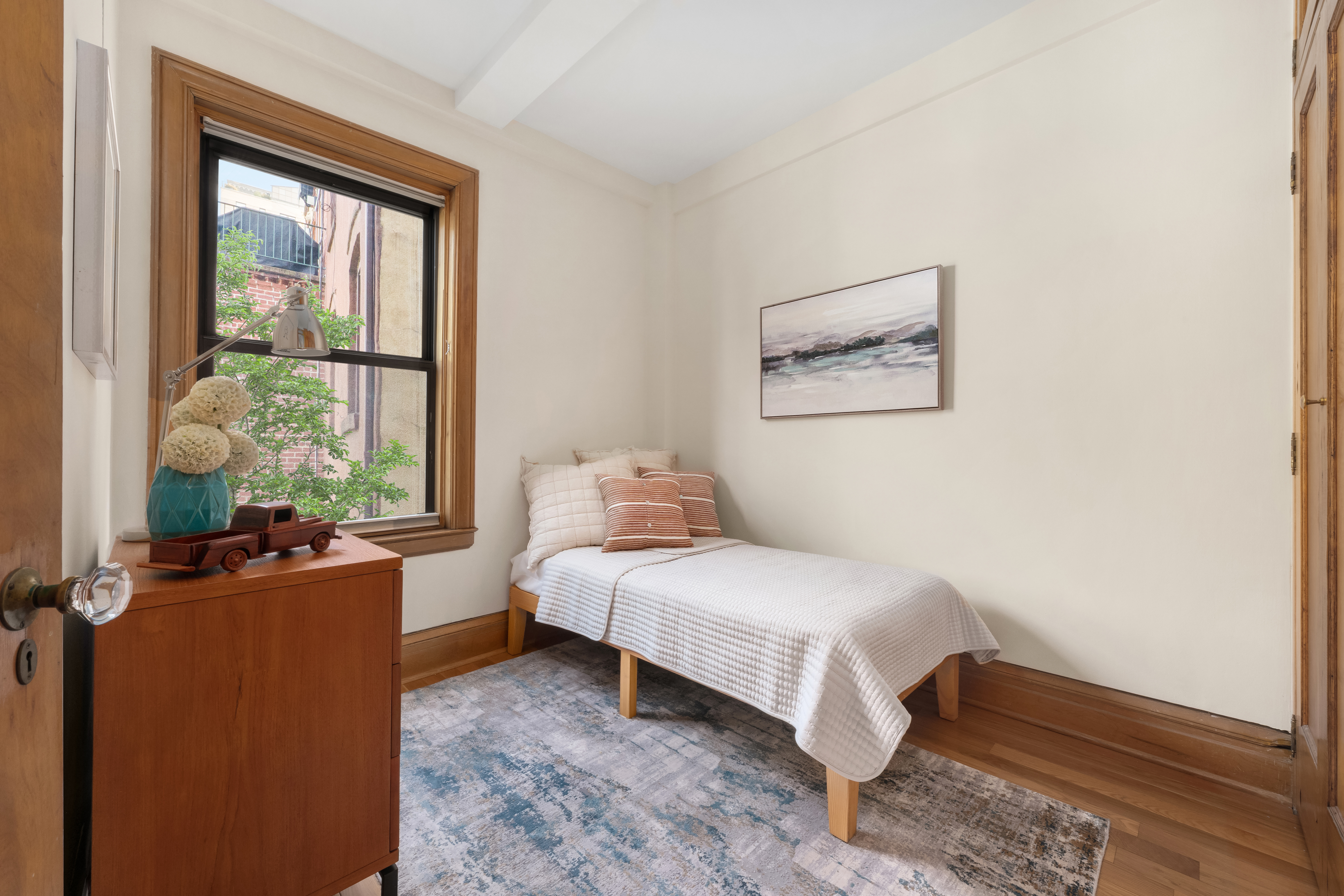 35 West 82nd Street, Unit 4C Manhattan, NY 10024 - Photo 7 of 11 a bedroom with a bed and a window