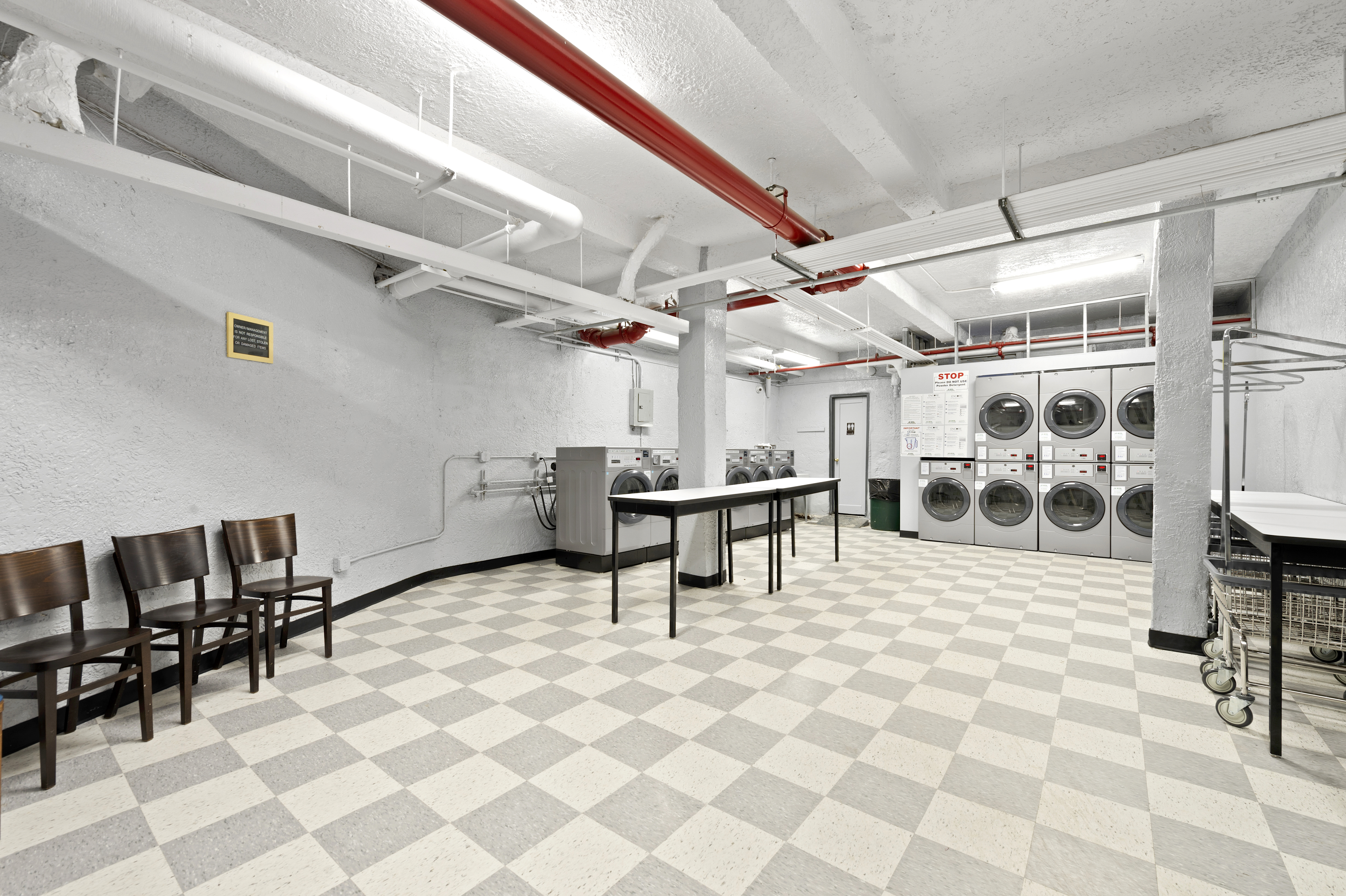 105-05 69th Avenue, Unit 301 Queens, NY 11375 - Photo 10 of 13 a view of a garage with table and chairs