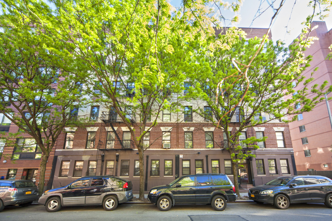 319 East 105th Street, Unit 5A Manhattan, NY 10029 - Photo 8 of 13 a cars parked in front of a building