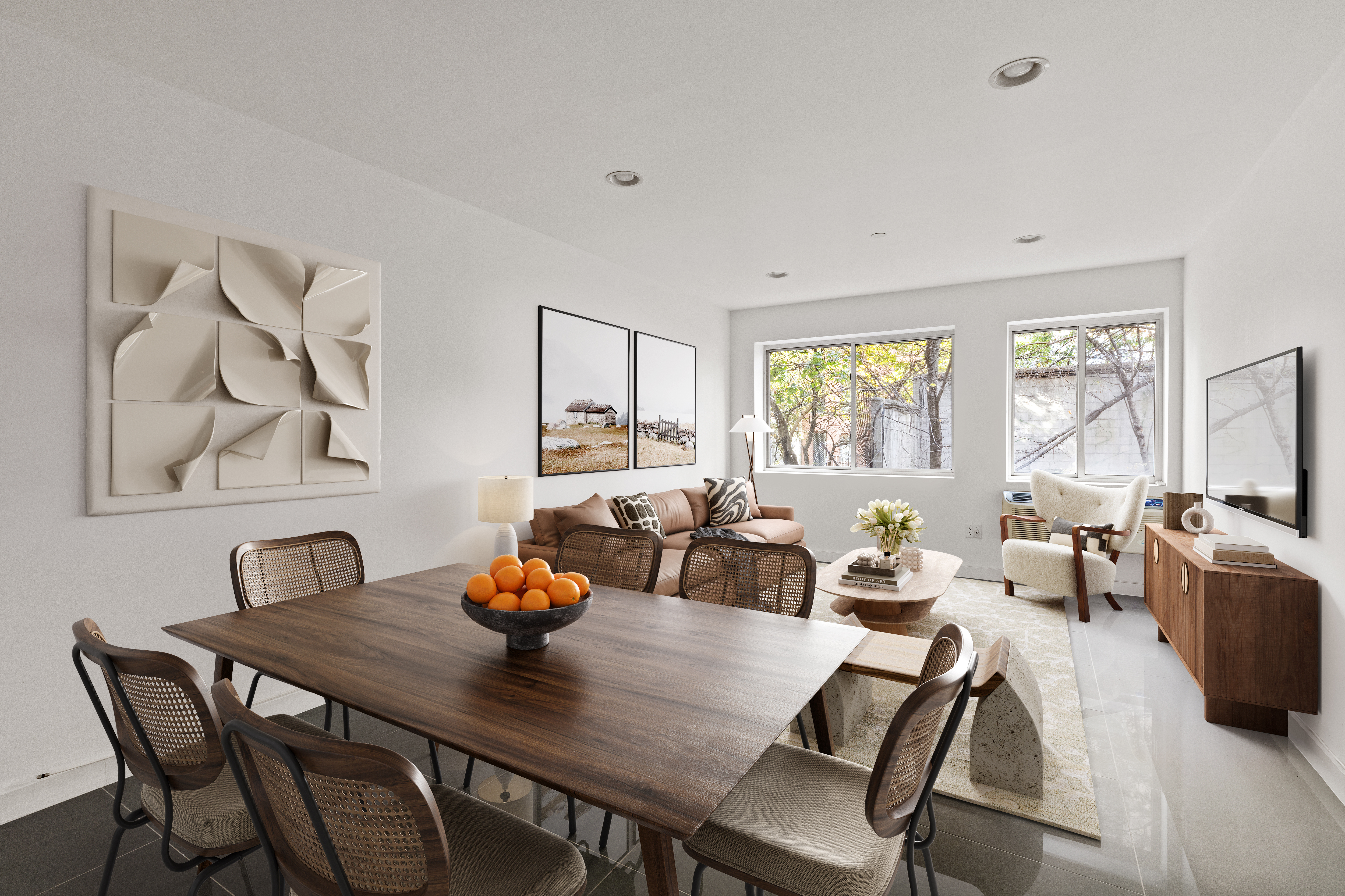 a view of a dining room with furniture a chandelier and wooden floor