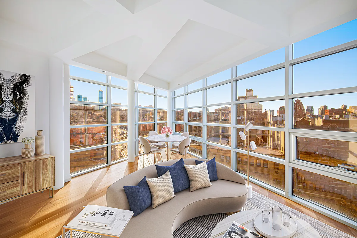 117 7th Avenue South, Unit 4E Manhattan, NY 10014 - Photo 2 of 4 a living room with furniture and a large window
